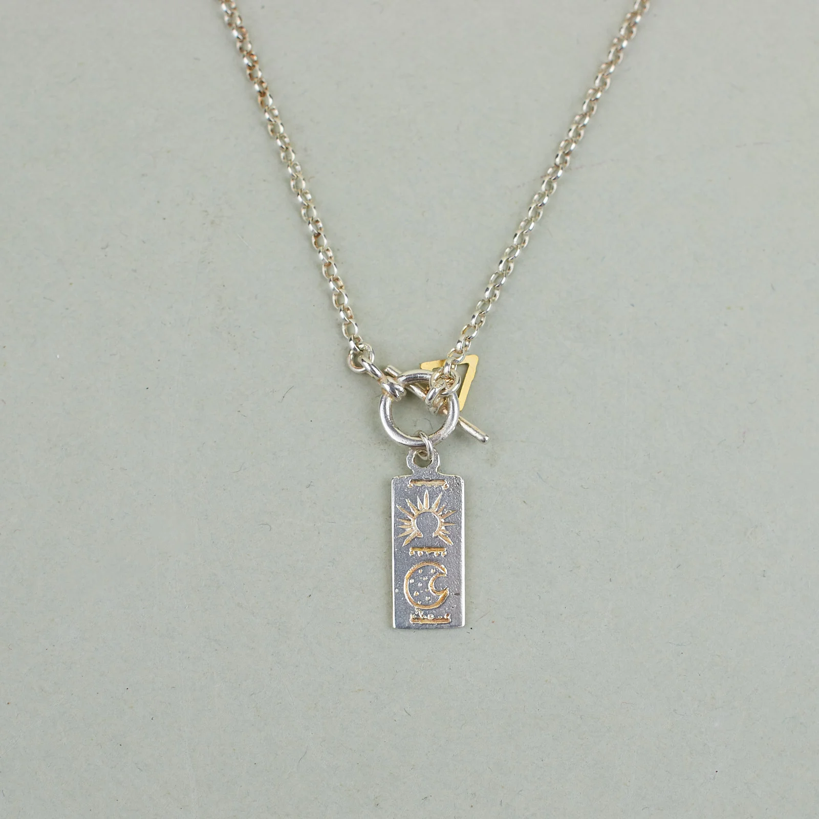 A NEW TRIBE NAGLE & SISTERS RECTANGLE TOKEN NECKLACE SILVER 01.jpg