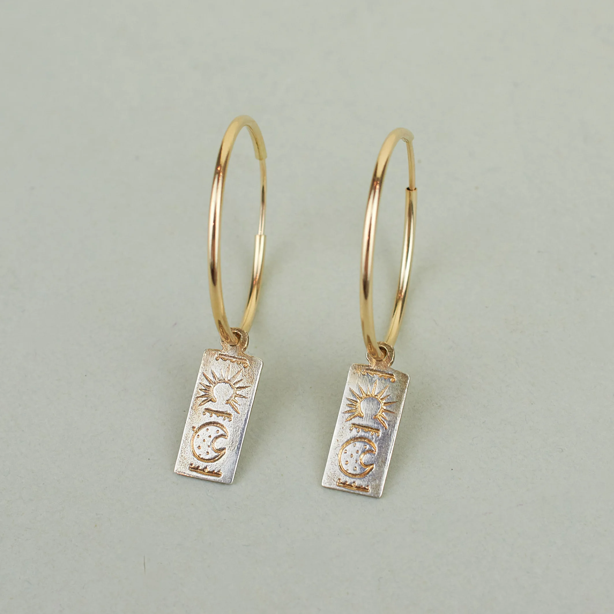 A NEW TRIBE NAGLE & SISTERS RECTANGLE TOKEN HOOPS 02 CROPPED.jpg