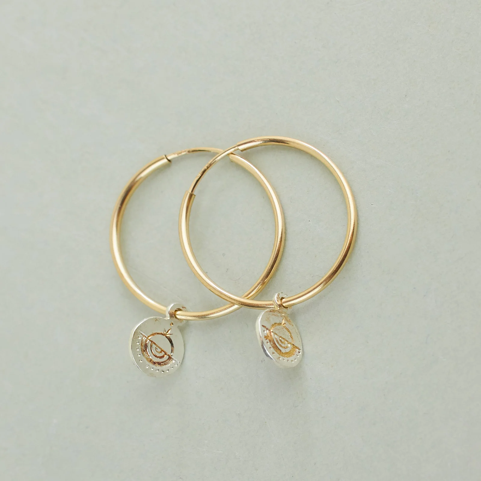 A NEW TRIBE NAGLE CIRCLE TOKEN HOOPS 02.jpg