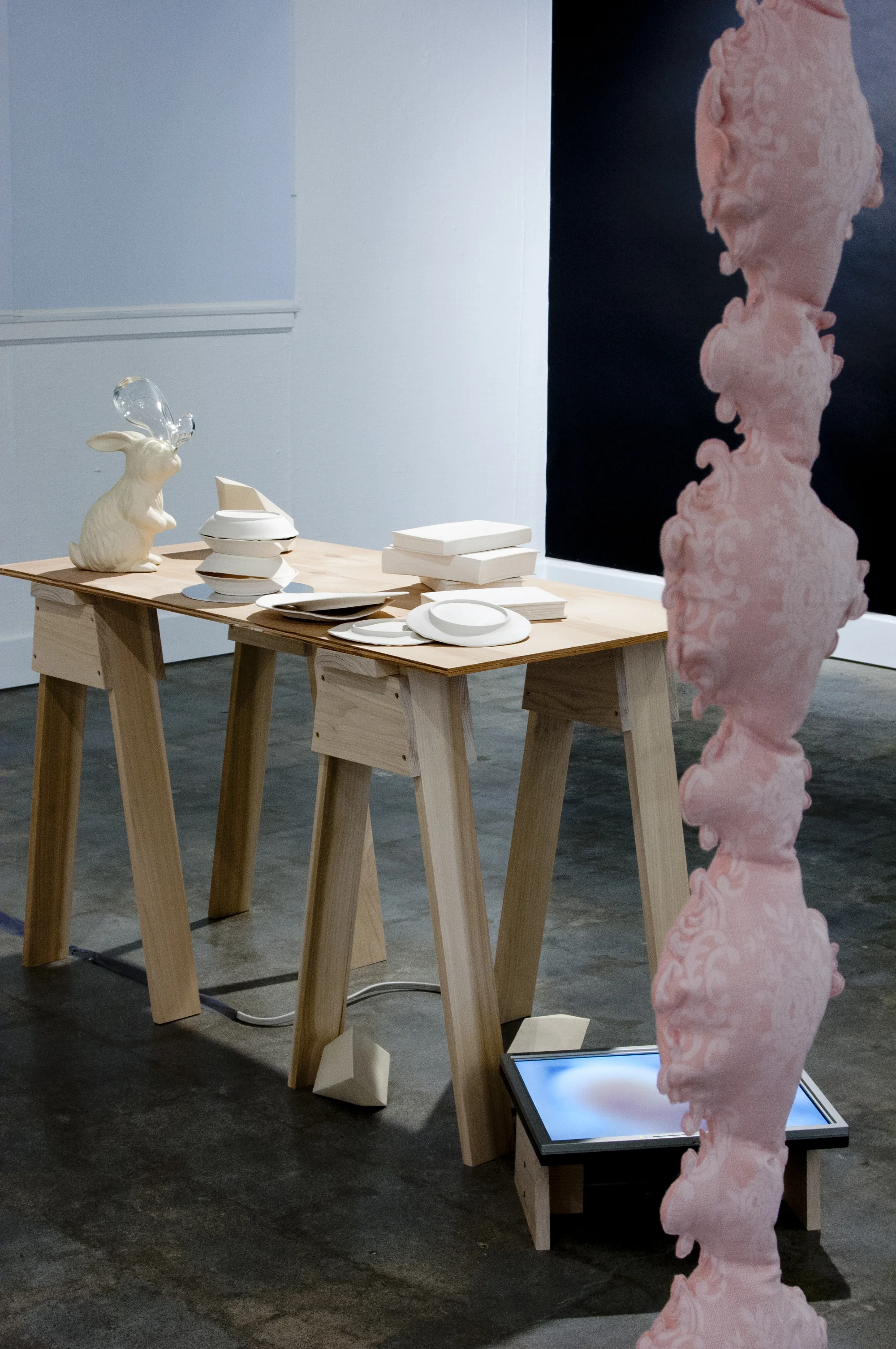 parlor games: parallax (installation detail with porcelain objects and single channel video)