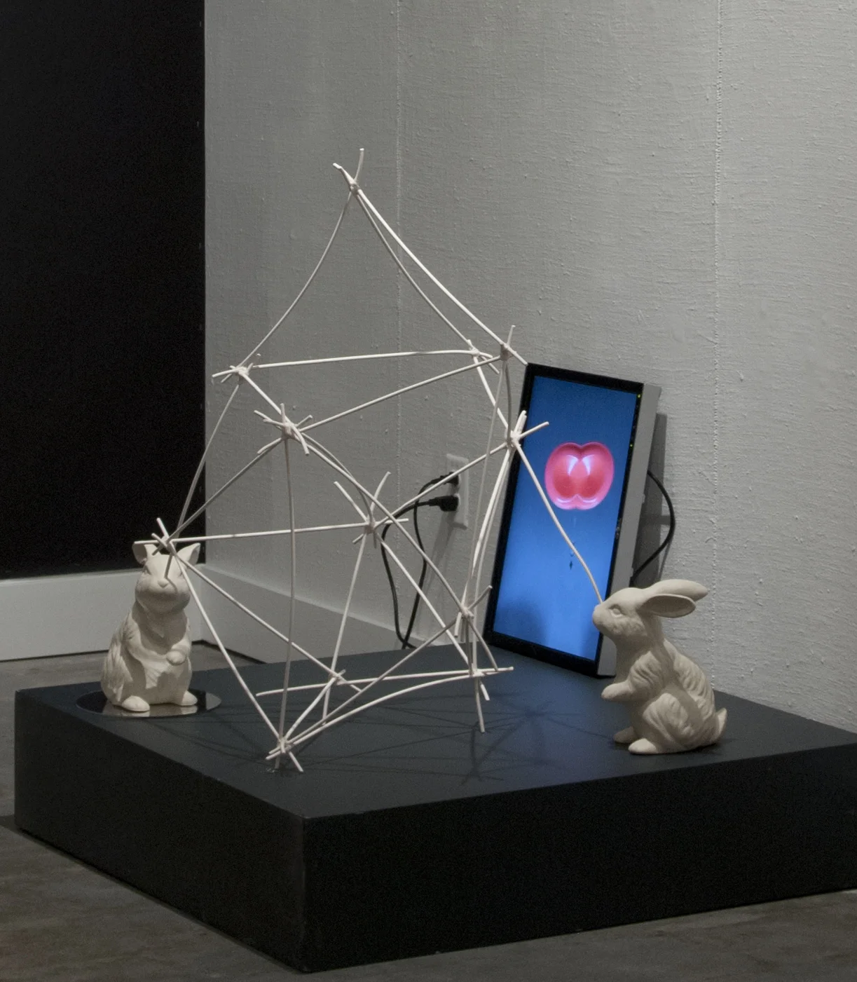 parlor games: parallax (installation detail with porcelain objects and single channel video)