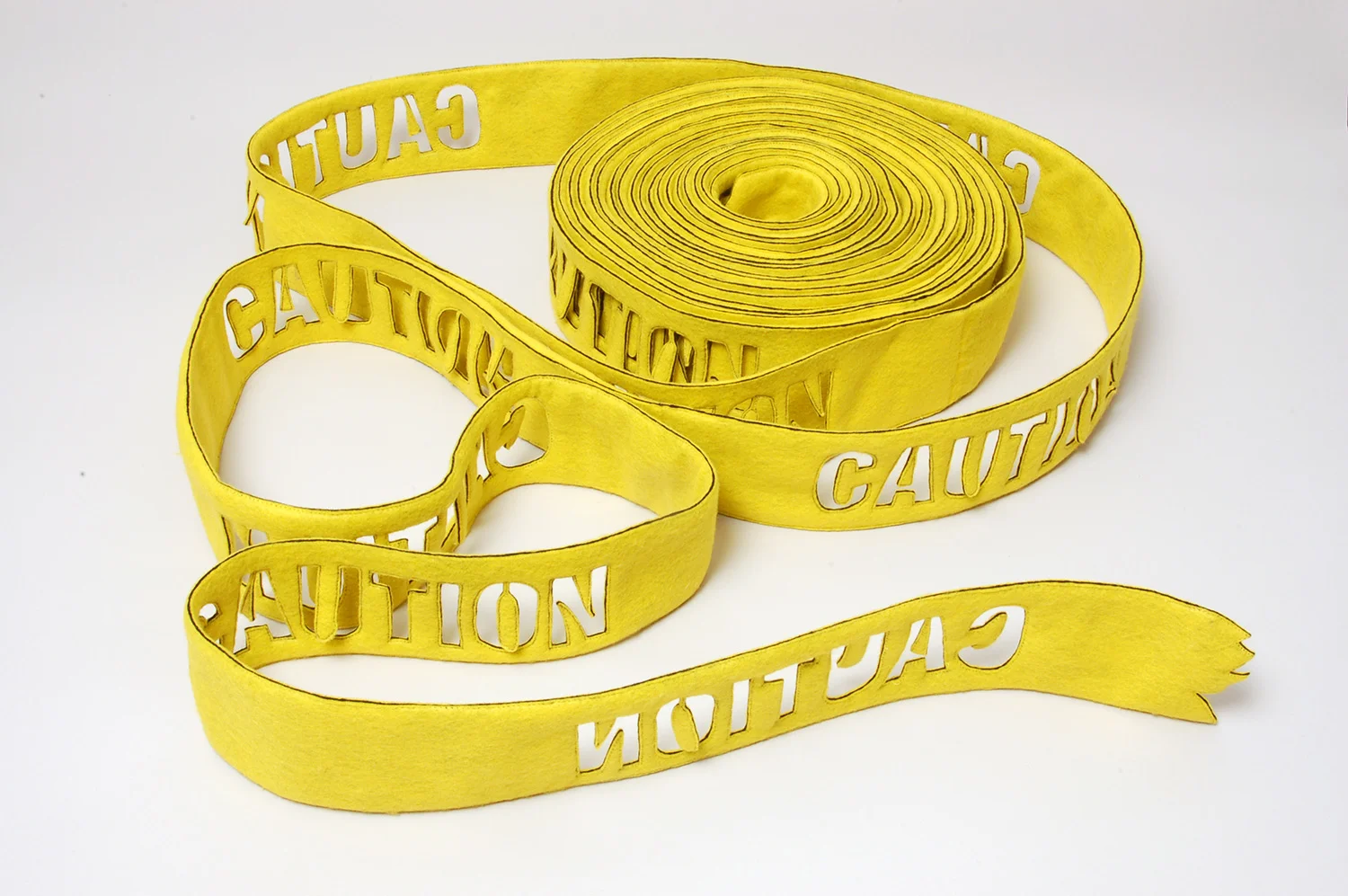 caution sewn and cut felt, 4"x400", 2009
