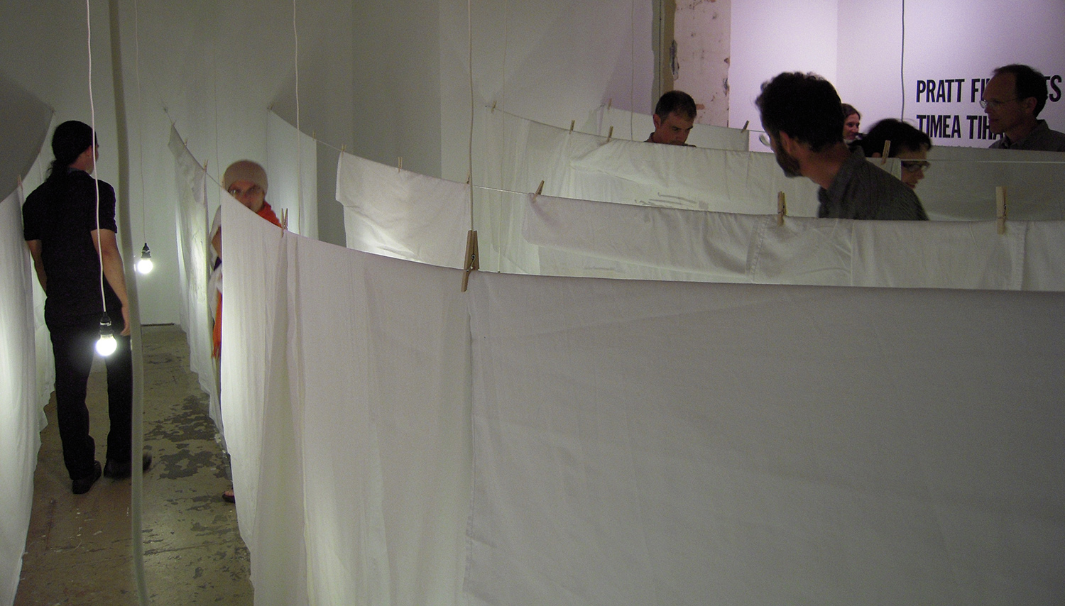 outside in, inside out: seeing ghosts (installation detail showing visitors moving through the space)