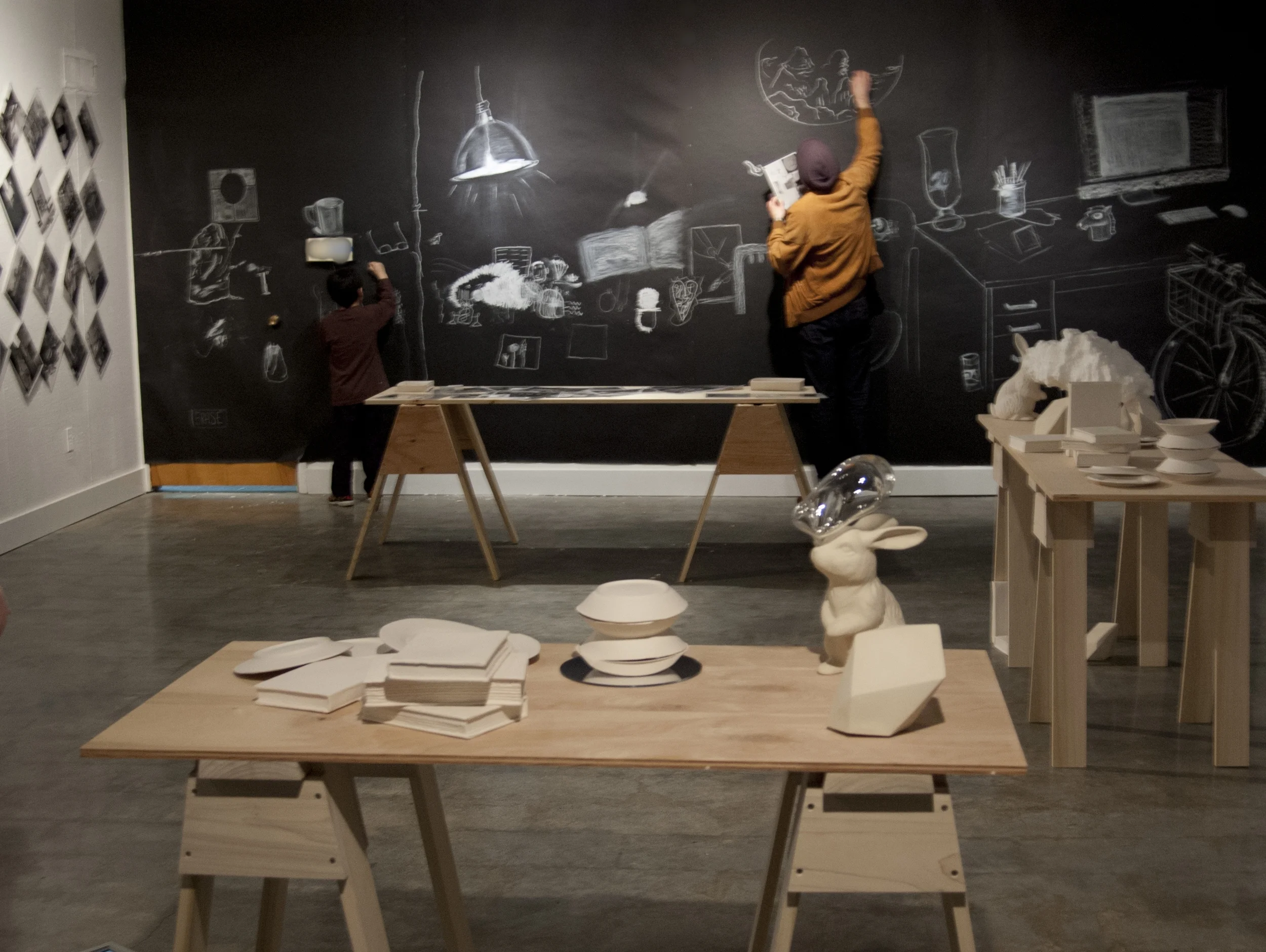 parlor games: parallax (installation detail with participants drawing on the wall)