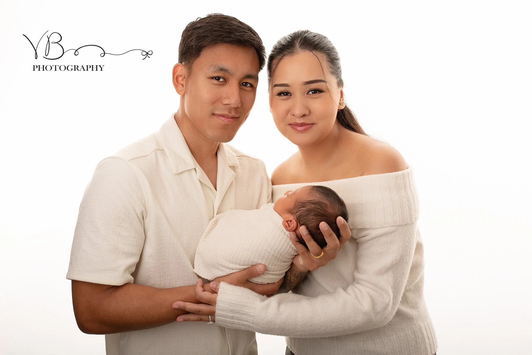family portrait with newborn baby during newborn photoshoot colchester