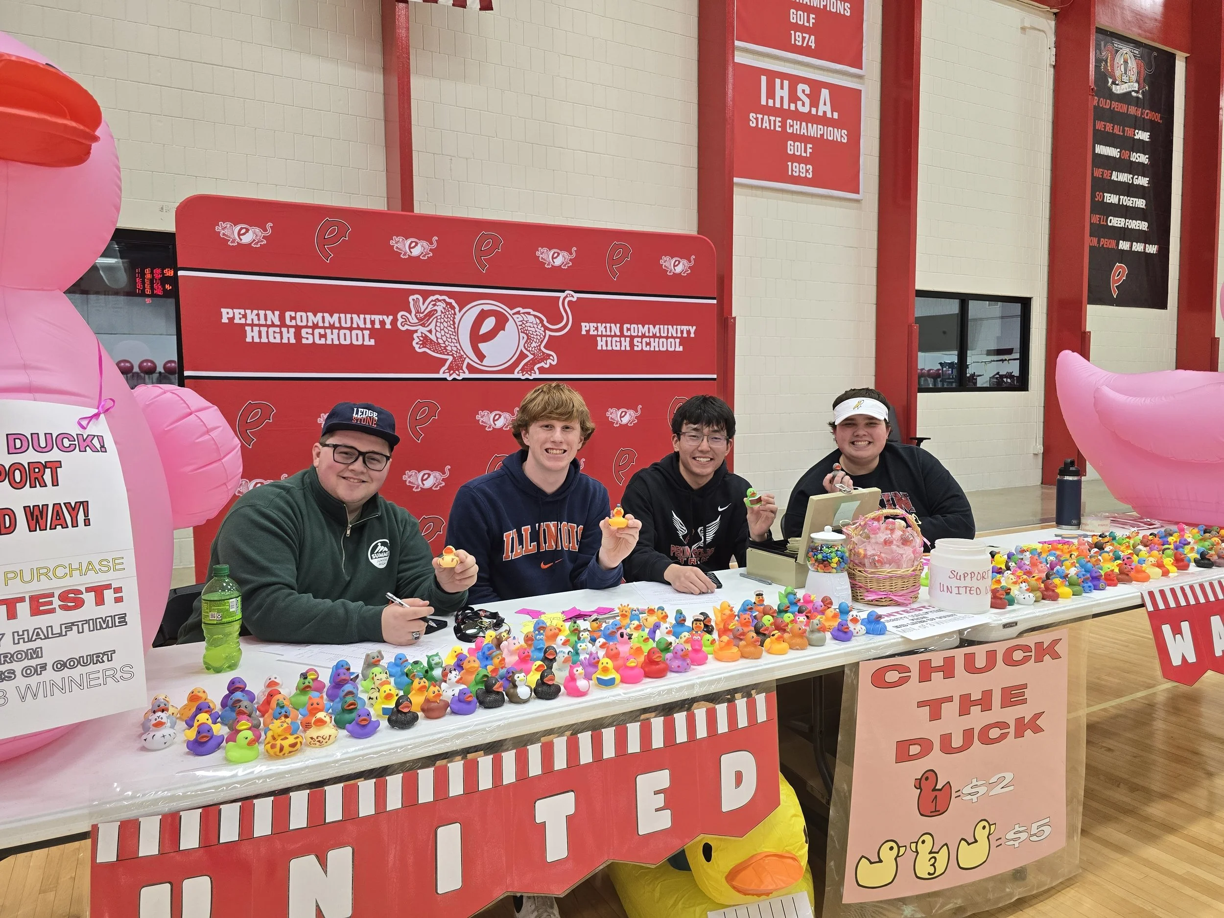 PCHS Students running the "Chuck A Duck" at the 2025 fundraiser game.