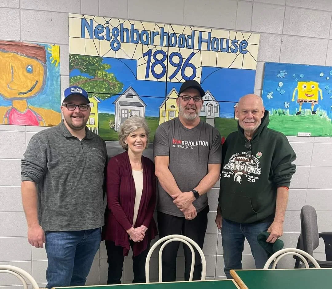 Exec. Director Keith McKeever with board members volunteering at Neighborhood House in 2024