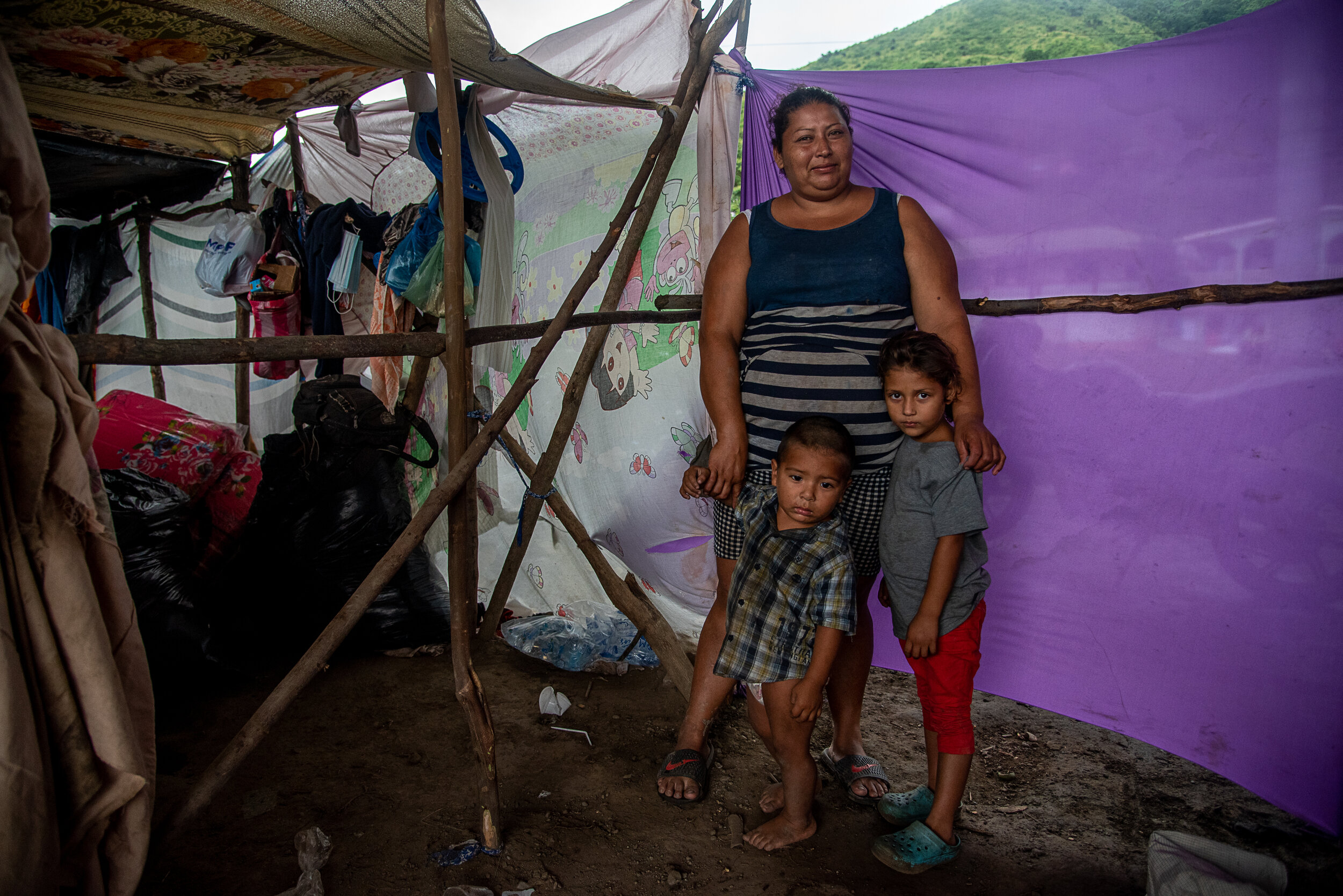  Concepcion Suazo, 33; Jared Alexander Benitez, 18 months; Kimberely, 4   Concepcion and her family recently began expanding the size of their provisional home in an unofficial refugee camp that has popped up underneath an overpass in Chamelecon, San