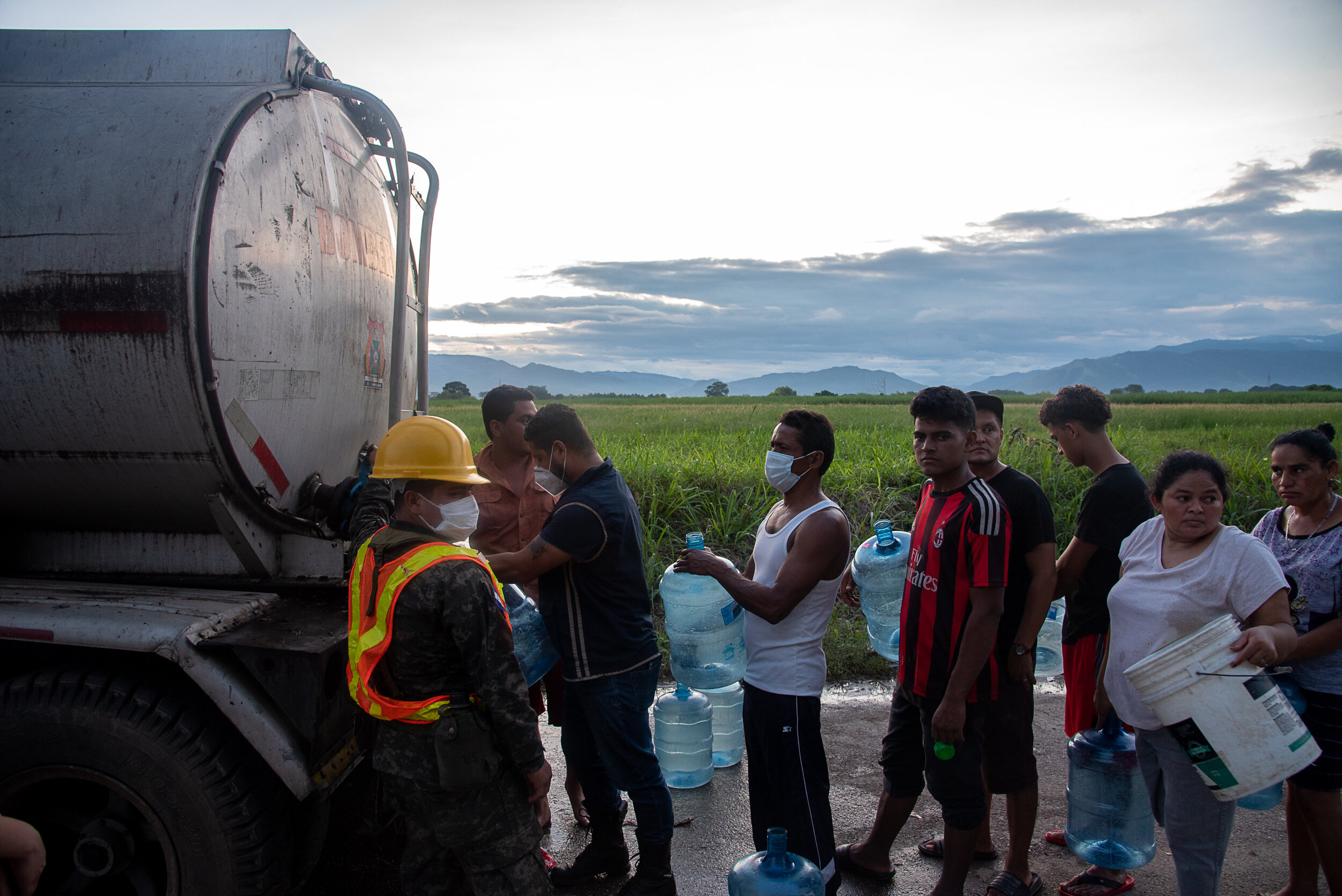  Citizens from Planeta, Honduras recieve drinking water from a truck after Hurricane Eta flooded low lying areas, leaving hundreds of thousands displaced. 