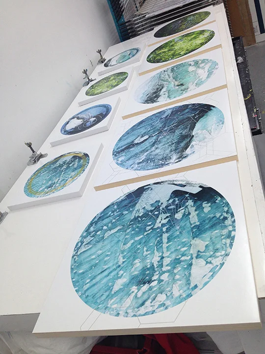 Photos mounted on wood panels