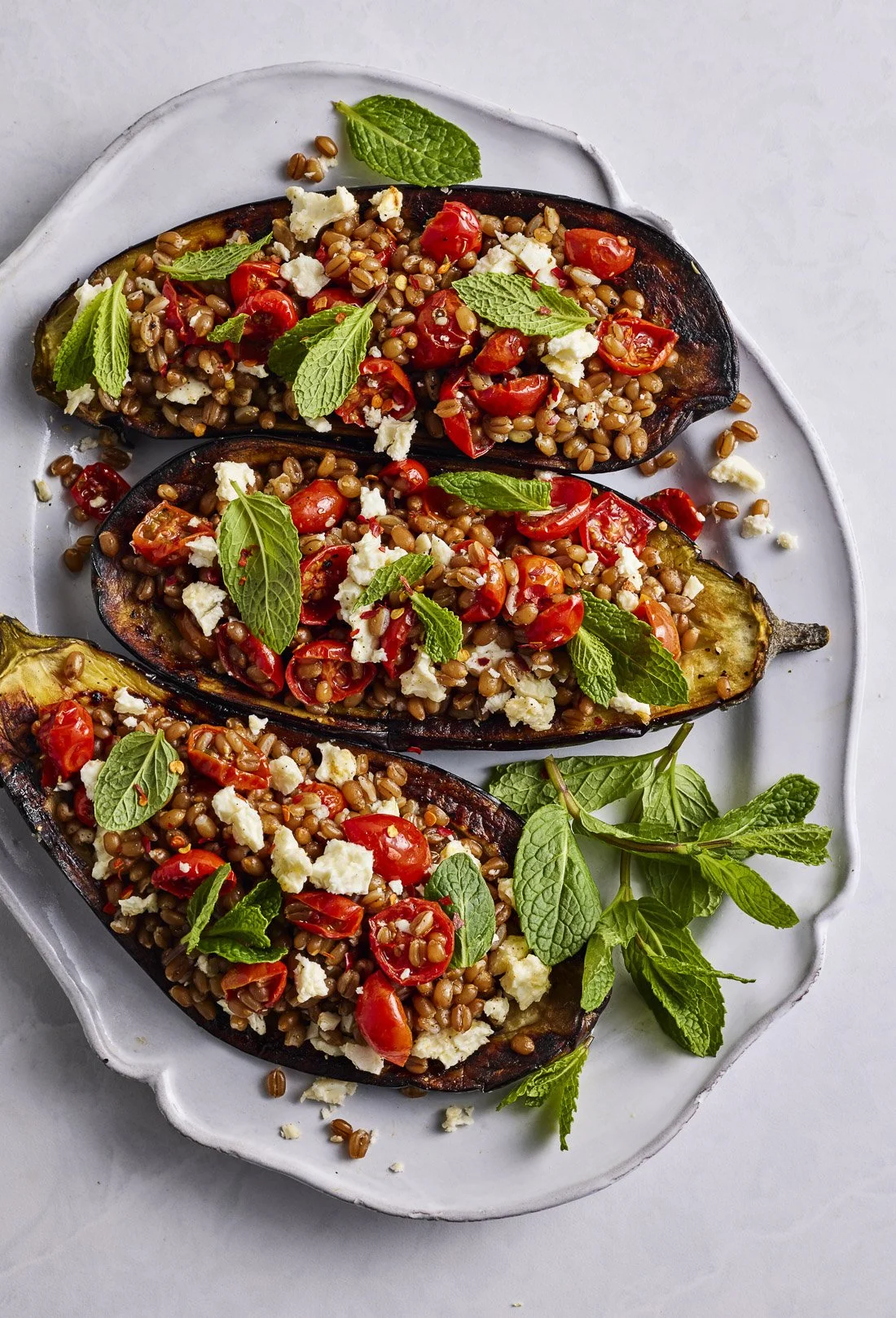 stuffed-eggplant-roasted-tomatoes-feta-mint-pop-of-flavor.jpg