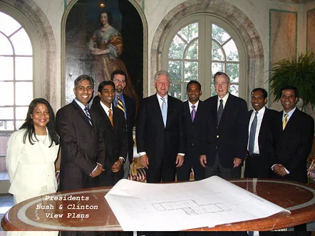 Presidents Bill Clinton and George Bush view plans for SLMANA Project.