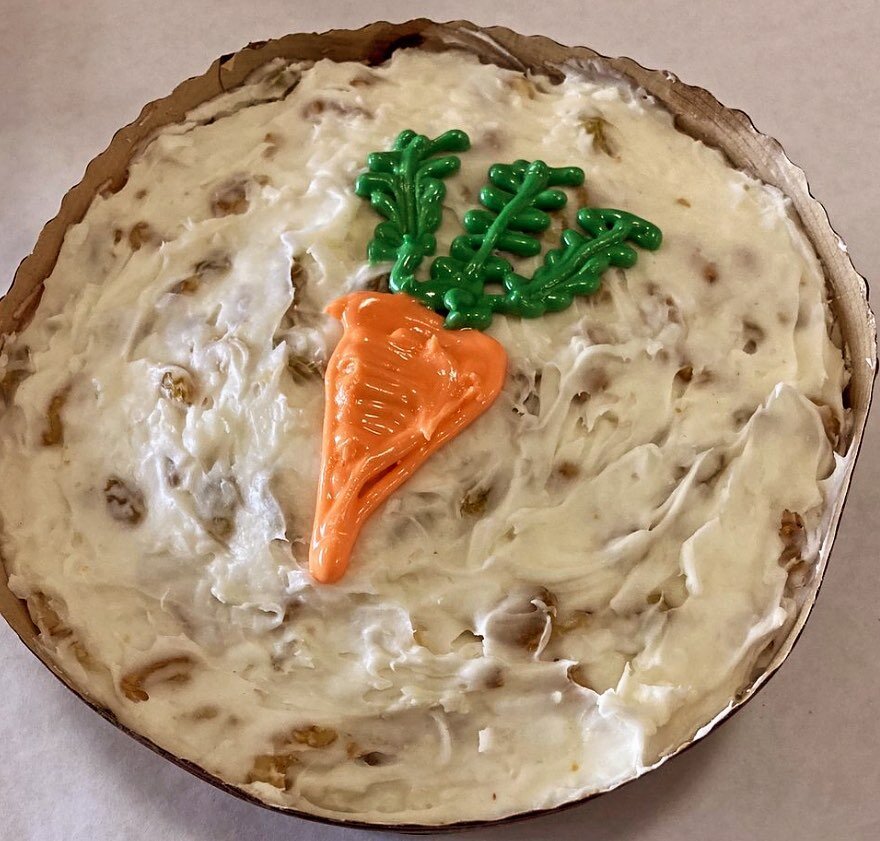 Carrot Cake: light carrot cake with and icing of cream cheese, butter, walnuts, coconut, and golden raisins.