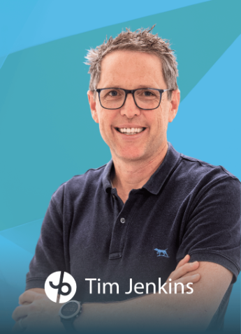 A smiling man wearing glasses and a dark polo shirt smiling with crossed arms, with text overlay indicating books are closed for new patient bookings. The image features a professional background with blue geometric shapes and a logo at the bottom.