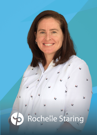 Portrait of a smiling Rochelle Staring with a blue geometric background, wearing a white blouse with small bird patterns, smiling at the camera, logo and name at the bottom.