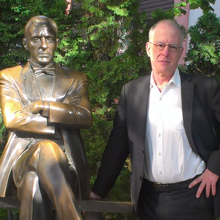 Photo of Paul Berman and bronze statue