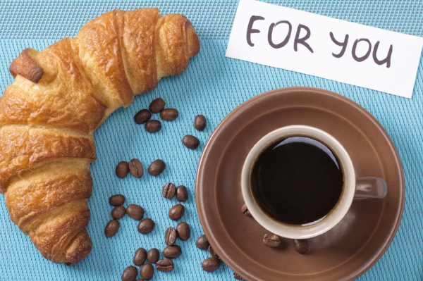 Croissant and coffee on the table. Morning french breakfast special for You.