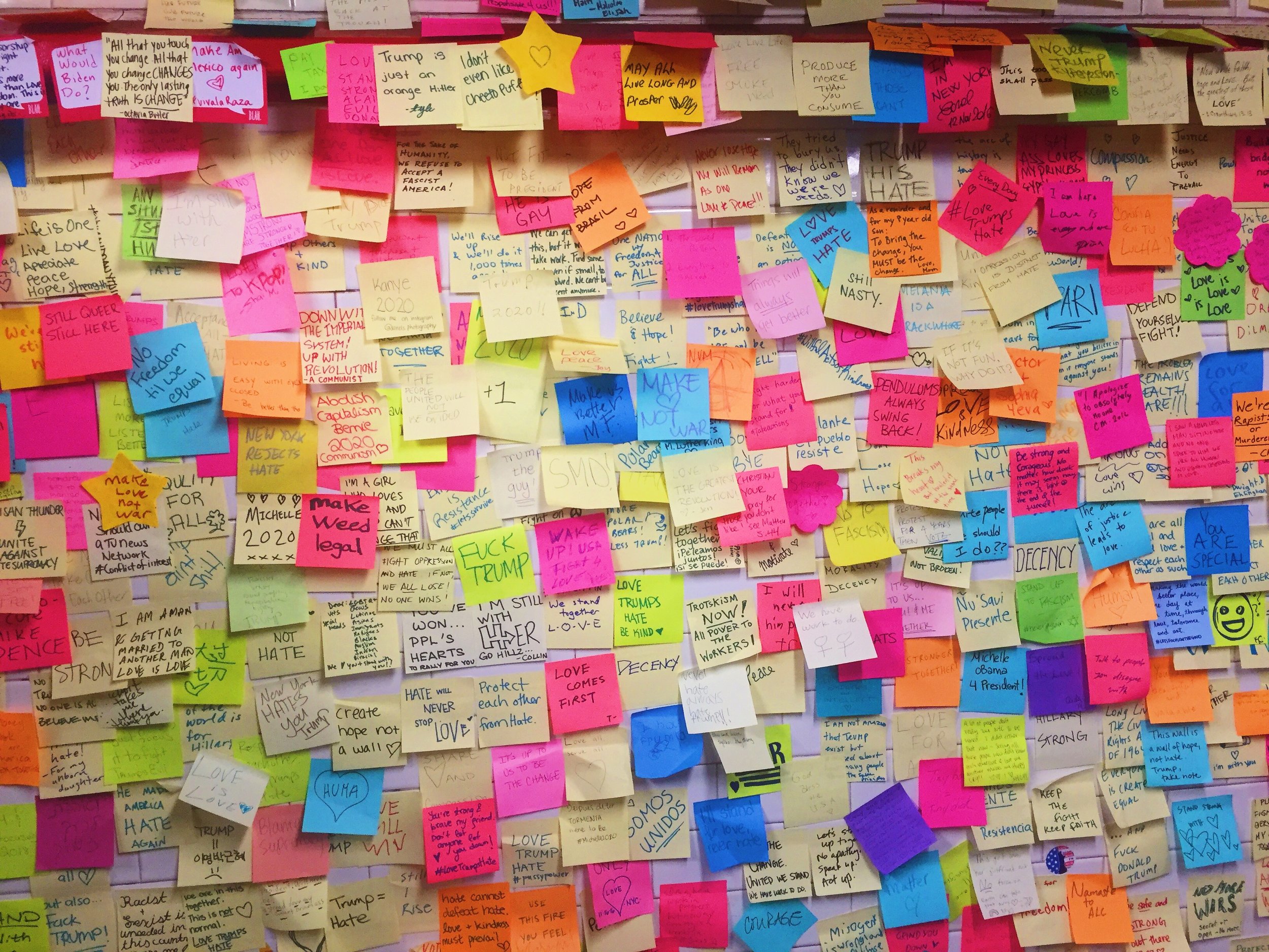  November 2016: New Yorkers write post-it notes of encouragement at Union Square station following the election of Donald Trump.    