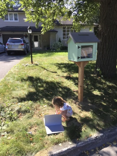 Our daughter is a faithful fan of our Little Free Library!