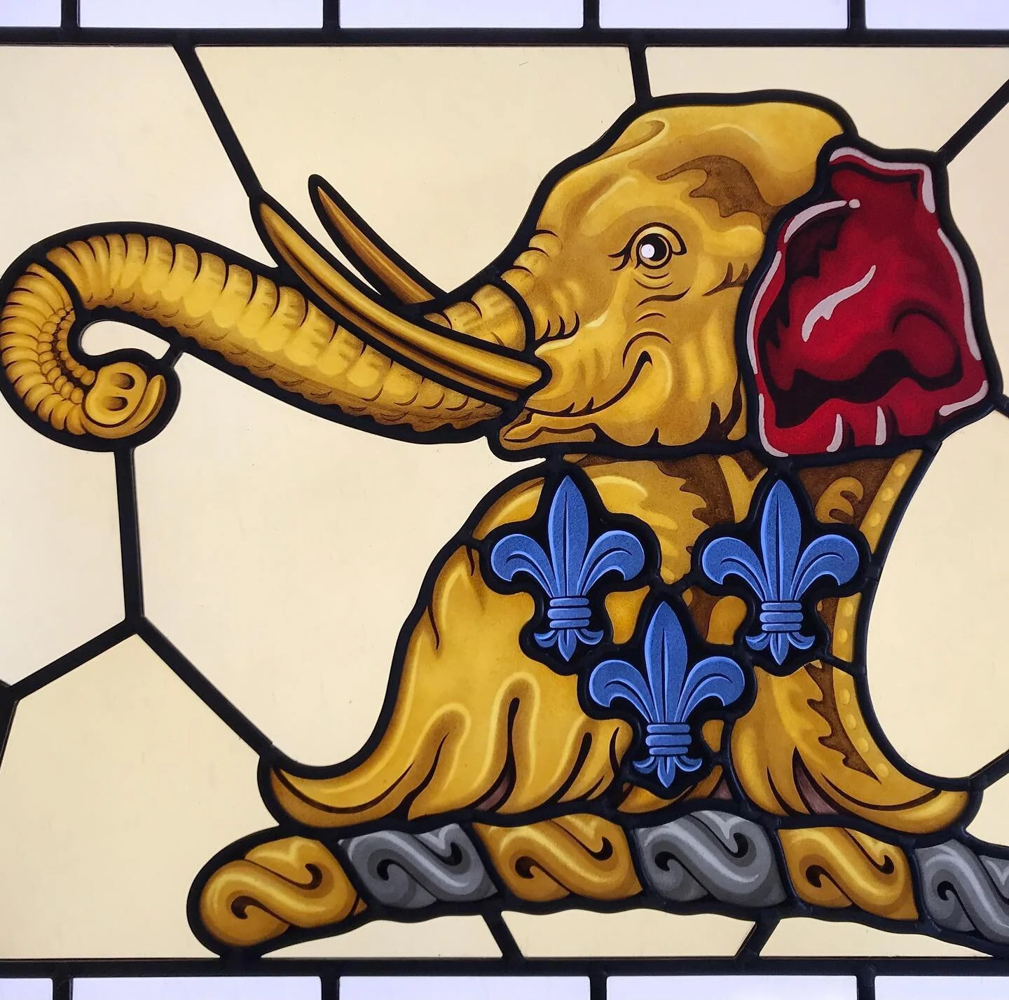 A commission from earlier this year - a stained glass window for a bathroom featuring the family crest. The elephant was painted with grisaille paints on clear glass and then silver-stained over two firings to achieve the variations in the yellow col