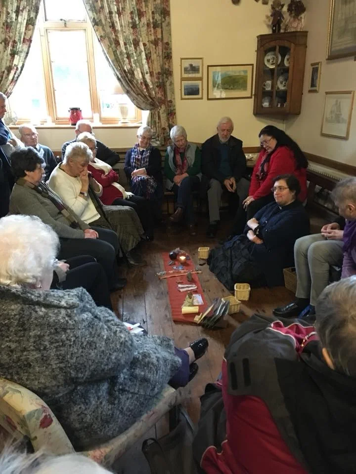 Rhiannon leads the group in telling the story of the parish