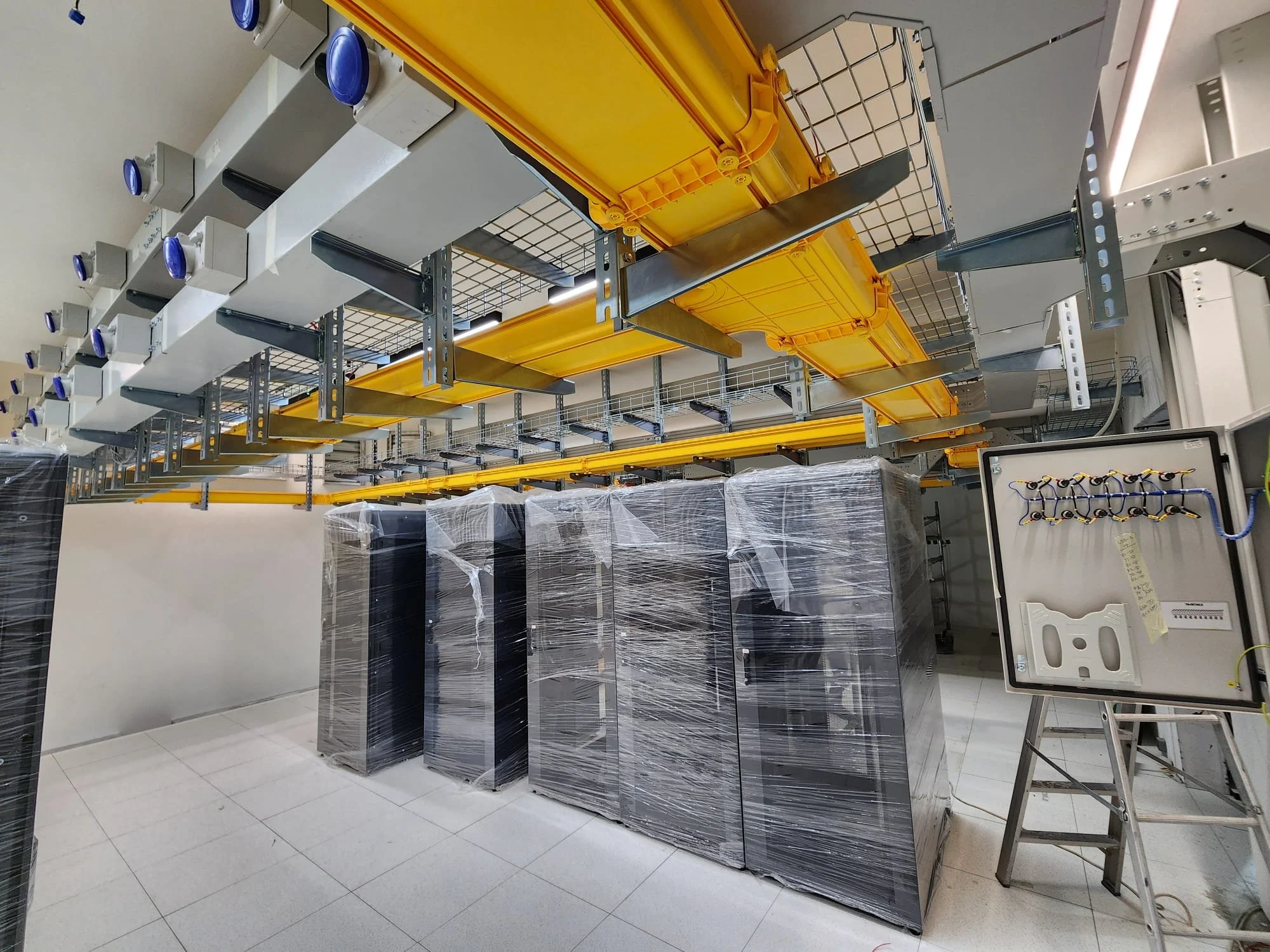 Racks being placed in data centre.jpg