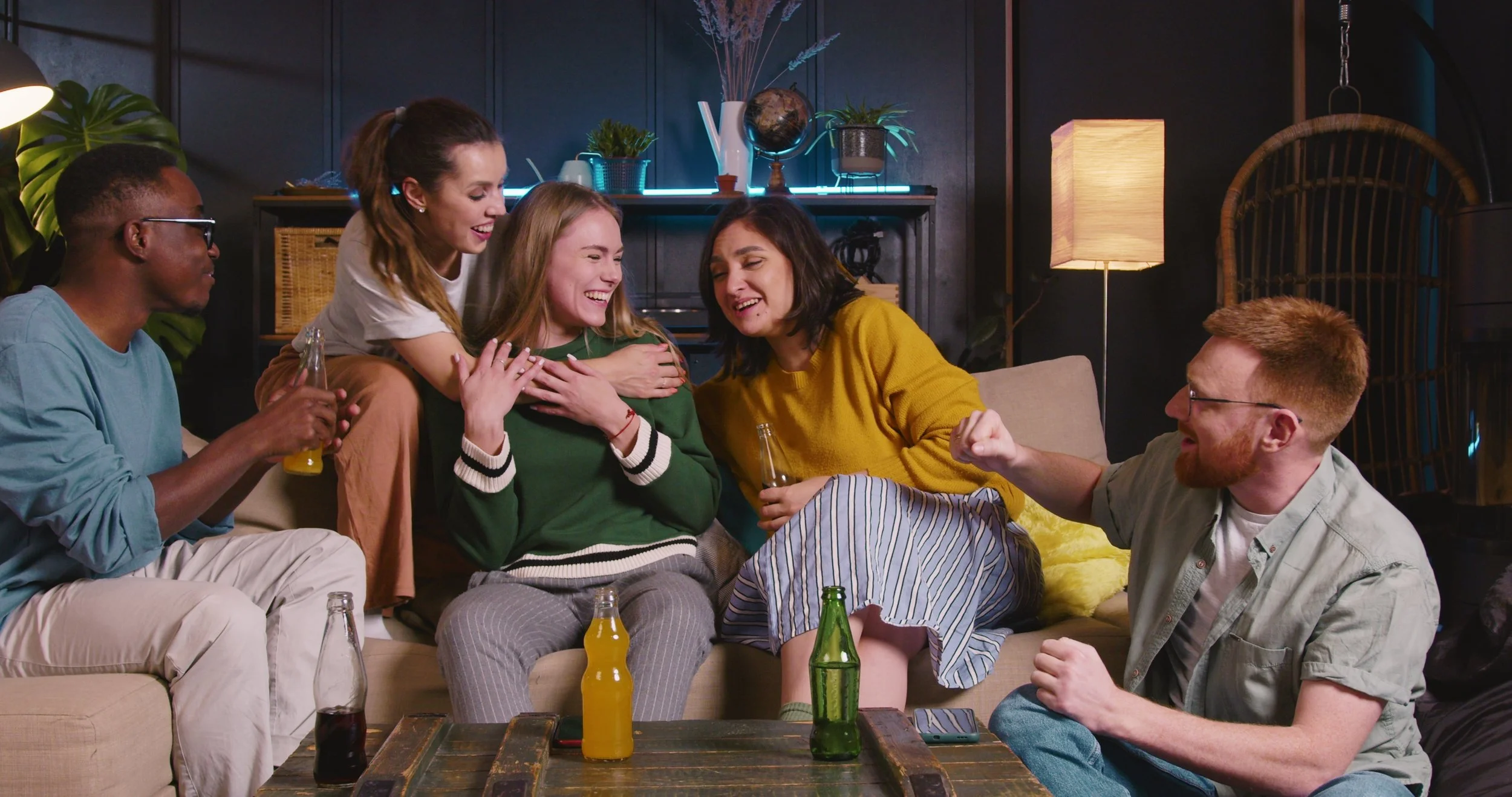 friendship-concept-beautiful-happy-young-blonde-woman-shares-good-news-with-multiethni-SBI-351548600.jpg