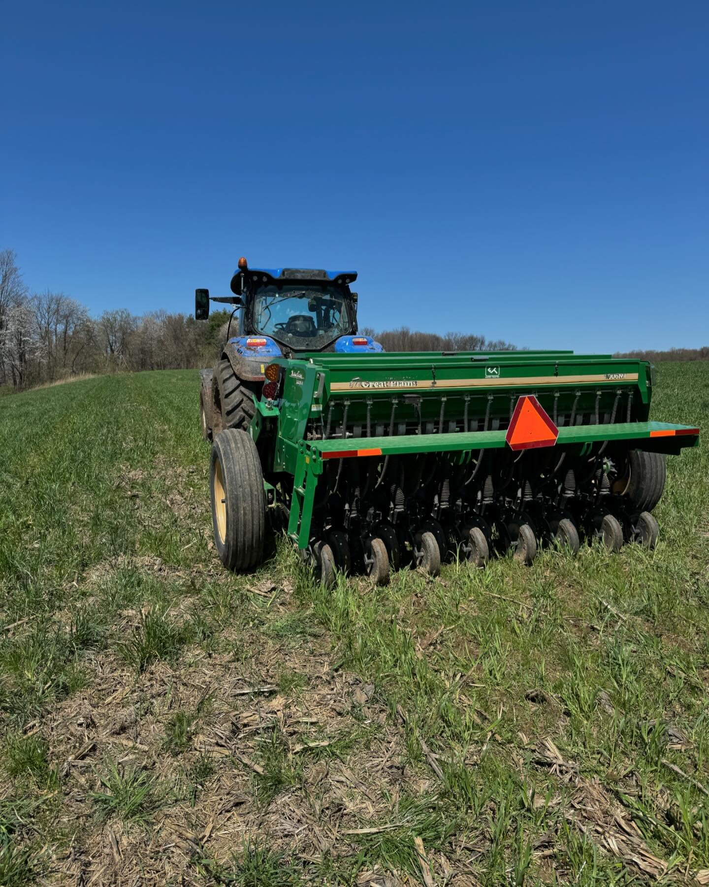 Spring work has begun! Here we are seeding grass for hay in one of our fields we grew corn in last year. It&rsquo;s a beautiful day for it!!