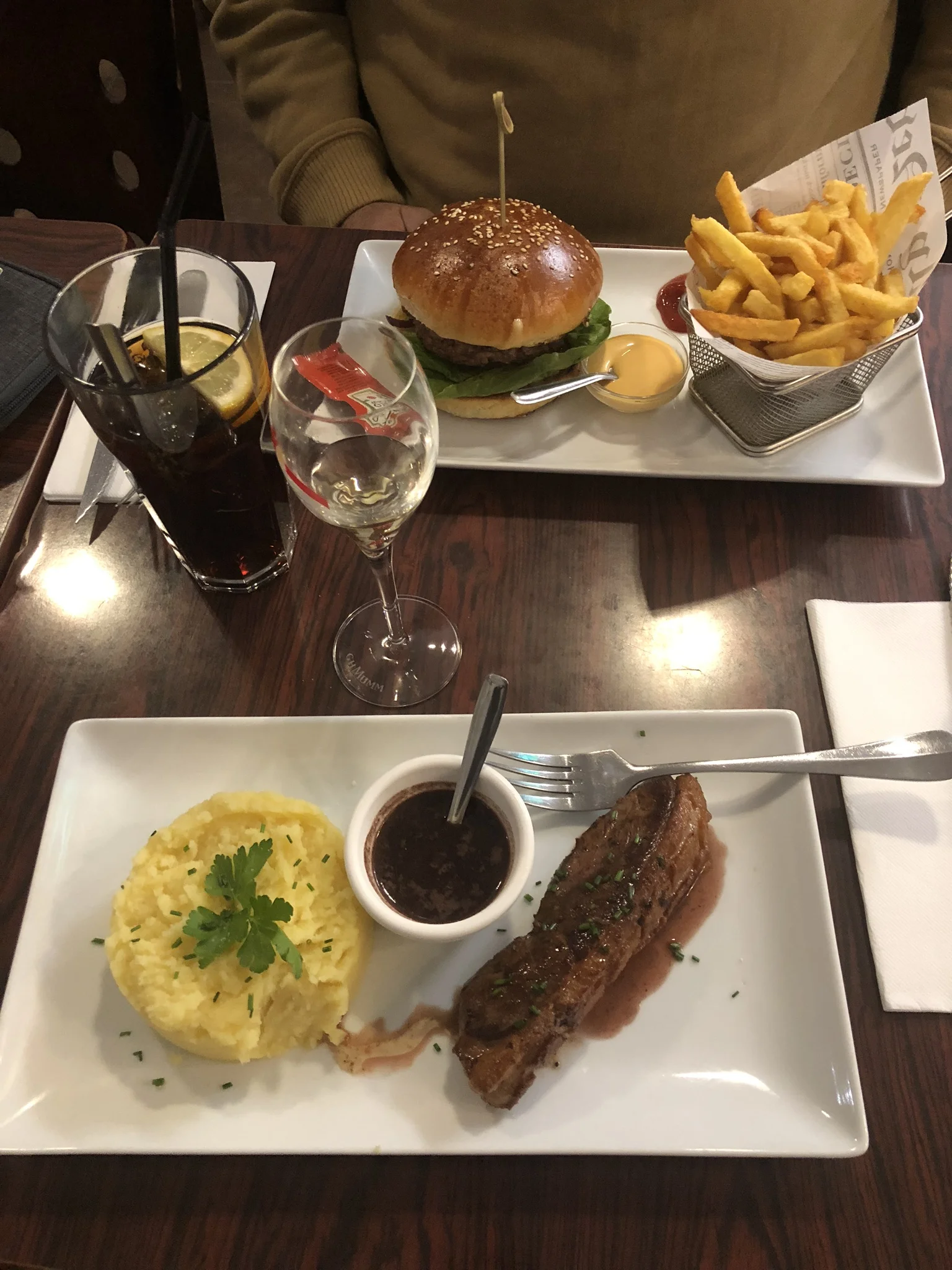 My husbands “American” cheeseburger and fries. I had lamb and potatoes with an amazing glass of champagne.
