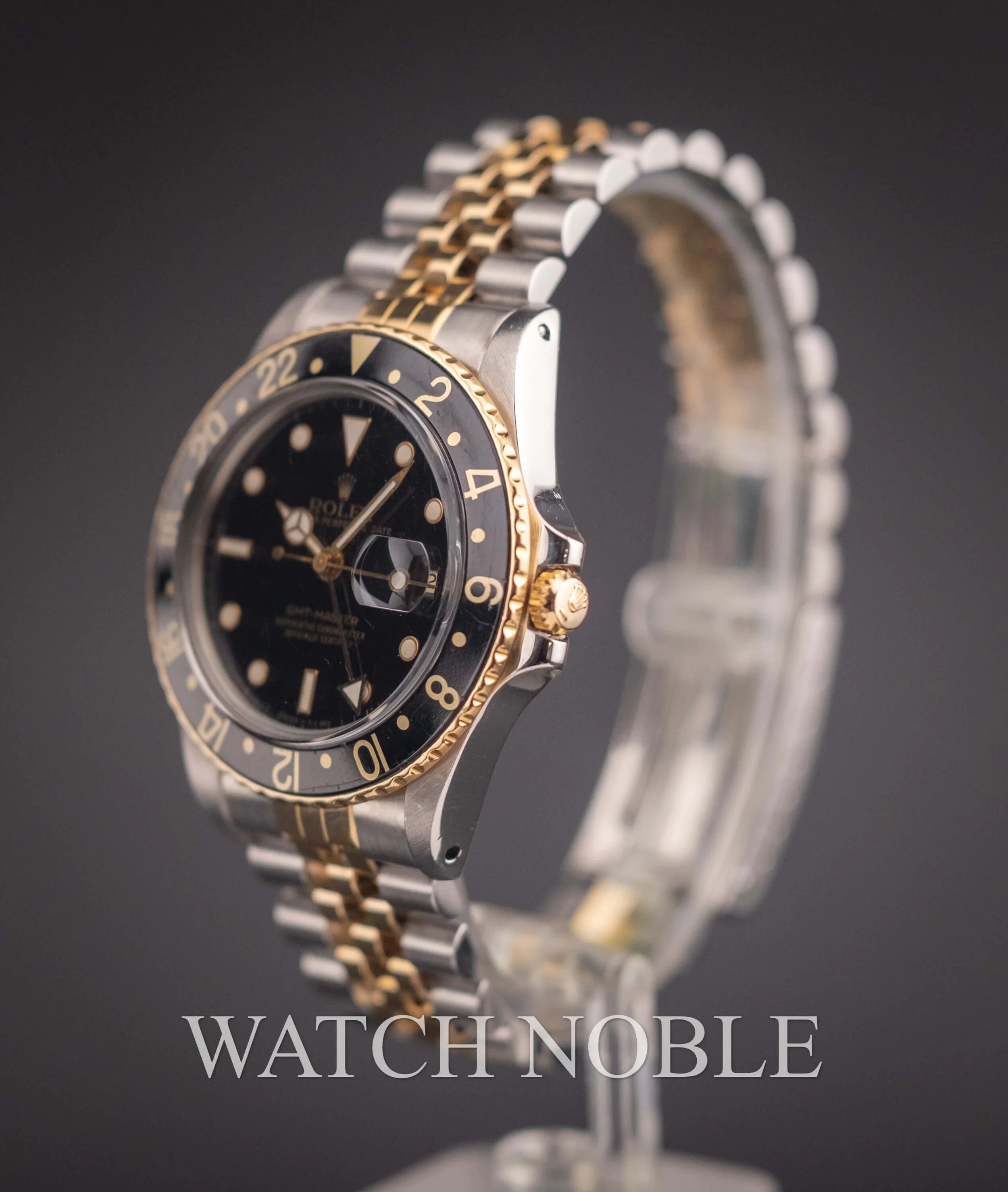 Vintage Rolex GMT Master 16753 Root Beer Bezel Stainless Steel /18k Yellow Gold Black Dial Jubilee Bracelet.