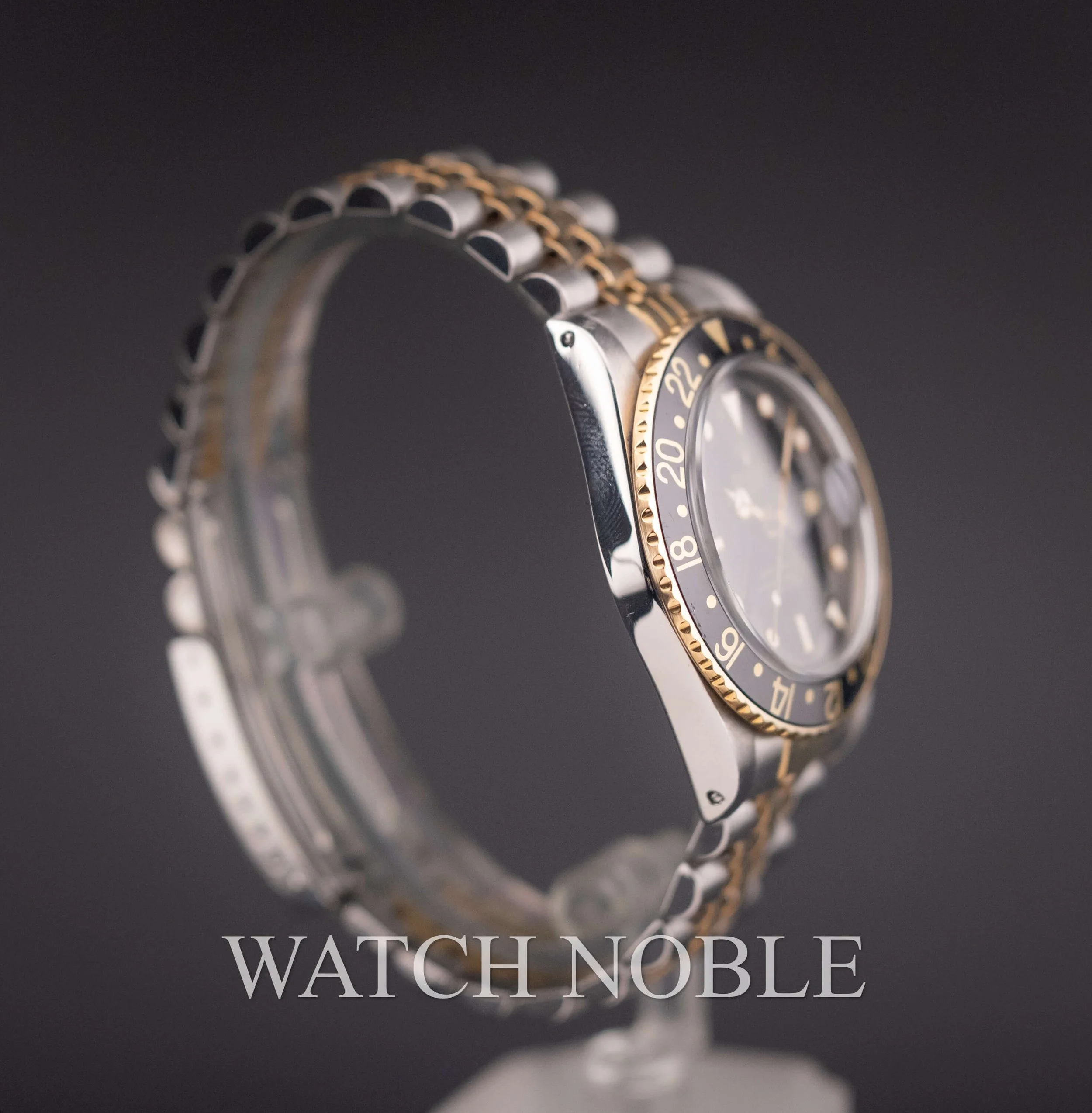 Vintage Rolex GMT Master 16753 Root Beer Bezel Stainless Steel /18k Yellow Gold Black Dial Jubilee Bracelet.