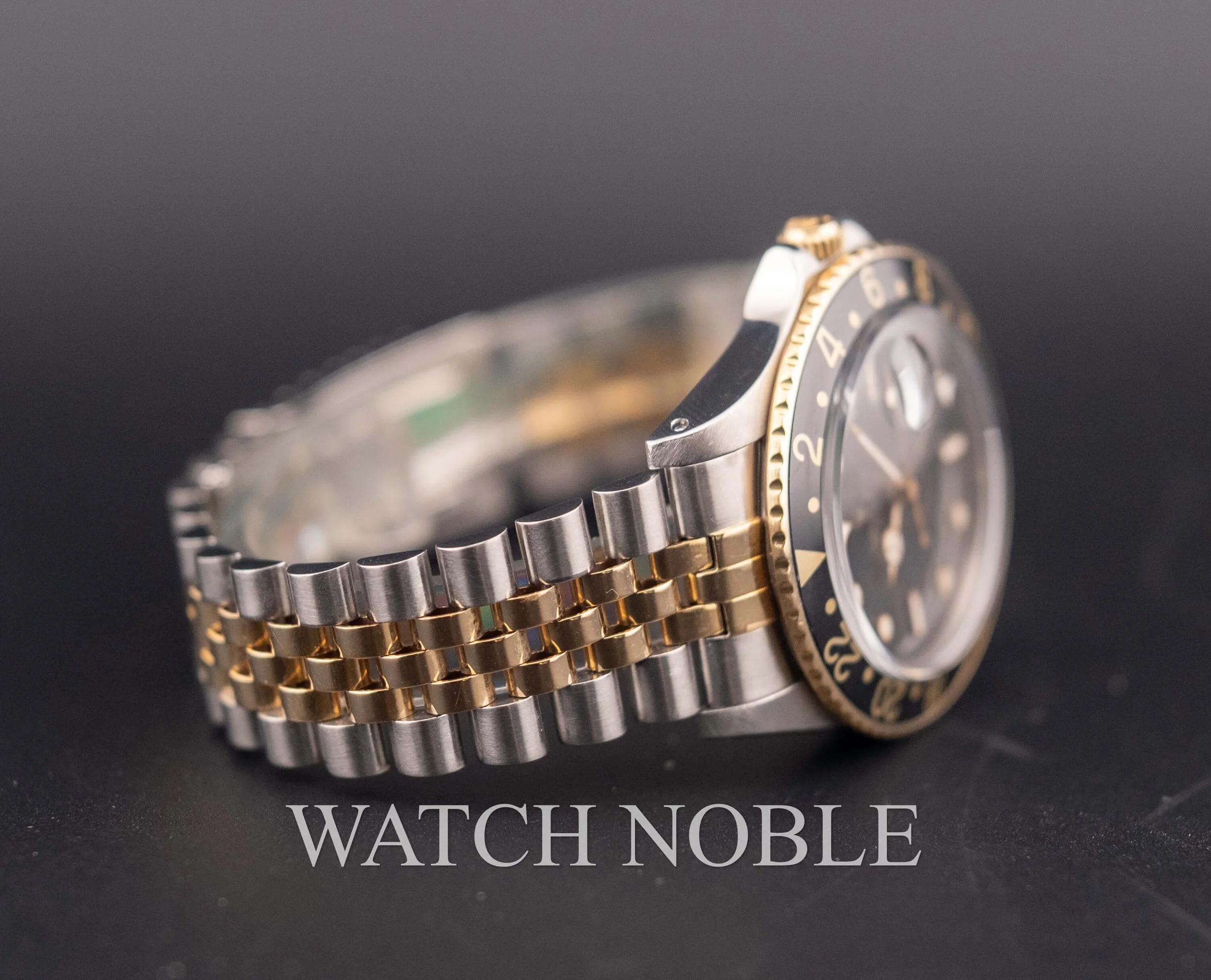 Vintage Rolex GMT Master 16753 Root Beer Bezel Stainless Steel /18k Yellow Gold Black Dial Jubilee Bracelet.