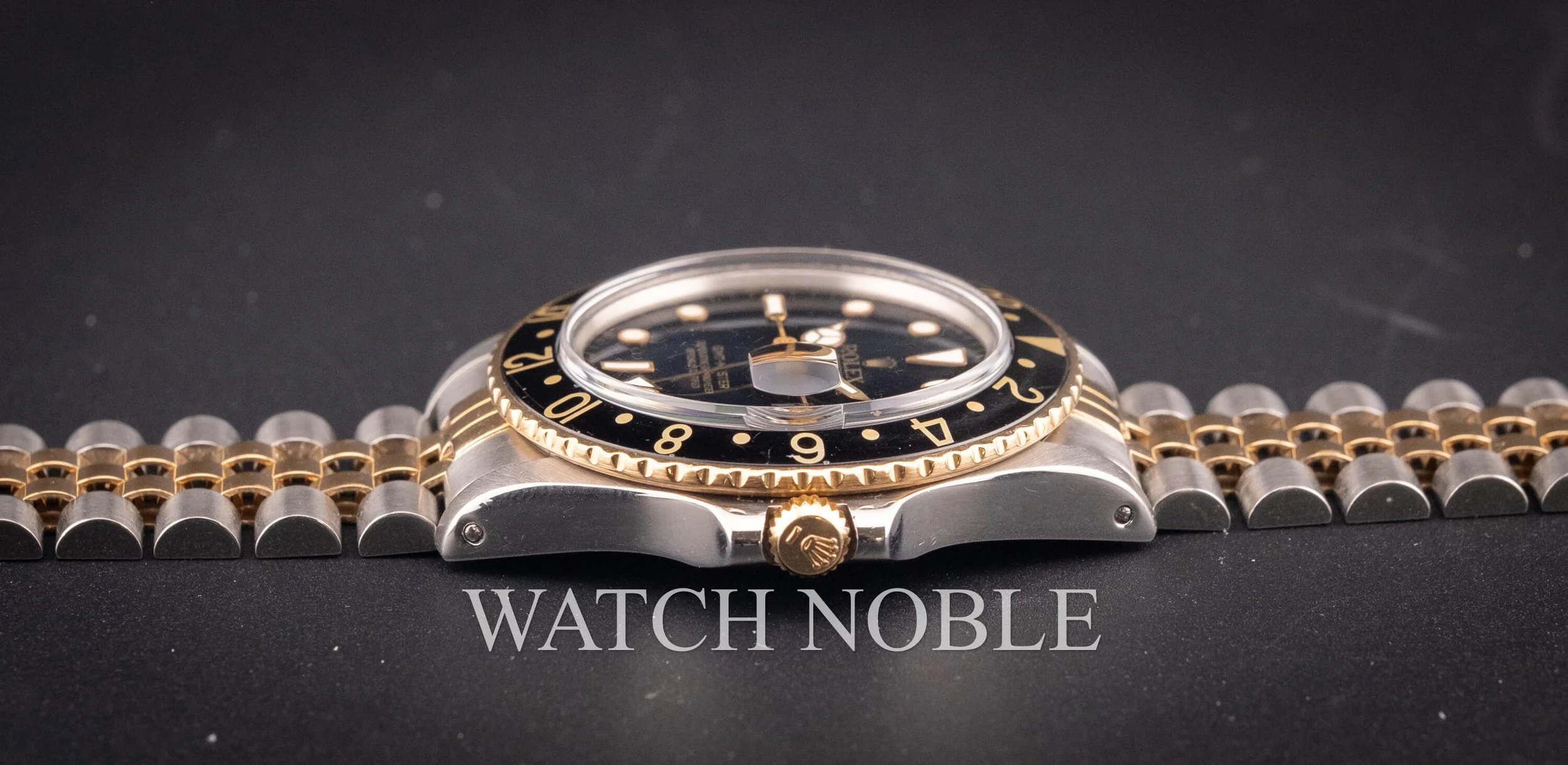 Vintage Rolex GMT Master 16753 Root Beer Bezel Stainless Steel /18k Yellow Gold Black Dial Jubilee Bracelet.