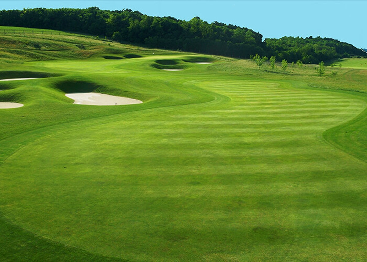 Pannonia Golf and Country Club, Mariavolgy, Hungary This private country club was designed as a place of art and culture 40 kilometres from Budapest’s city centre. Situated in a beautiful valley west of Budapest, The Pannonia Golf & Country Club is considered to be to finest golf course in Hungary. The course was co-designed with Austrian golf course architect Hans Erhardt. Carrick Design’s involvement included co-design of the course routing, development of detailed grading plans and several site visits during construction. Undulating fairways accented with deep sod faced bunkers and subtly contoured greens define the challenge and aesthetic character of the course.