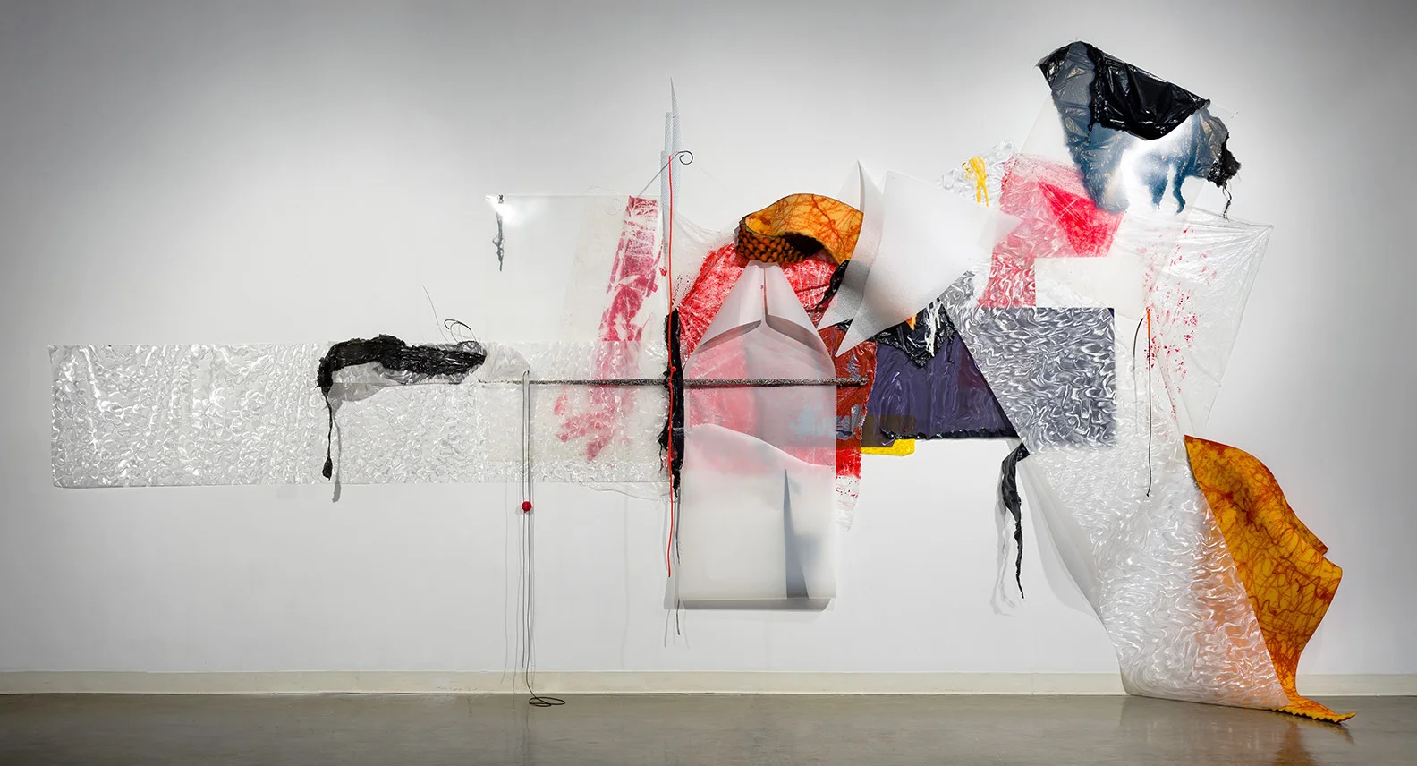 Gelah Penn, Situations (2017), Plastic tarps, foam rubber, lenticular plastic, Denril, plastic garbage bags, polyethylene sheets, stainless steel Choreoys, black foil, mosquito netting, latex & silicone tubing, mosquito netting, metal rods & staples, acrylic paint, rubber ball, upholstery & T-pins; 132 x 432 x 365 inches; Amelie A. Wallace Gallery, SUNY College at Old Wesbury, Old Westbury, NY. All photos Dave Clough Photography and Etienne Frossard