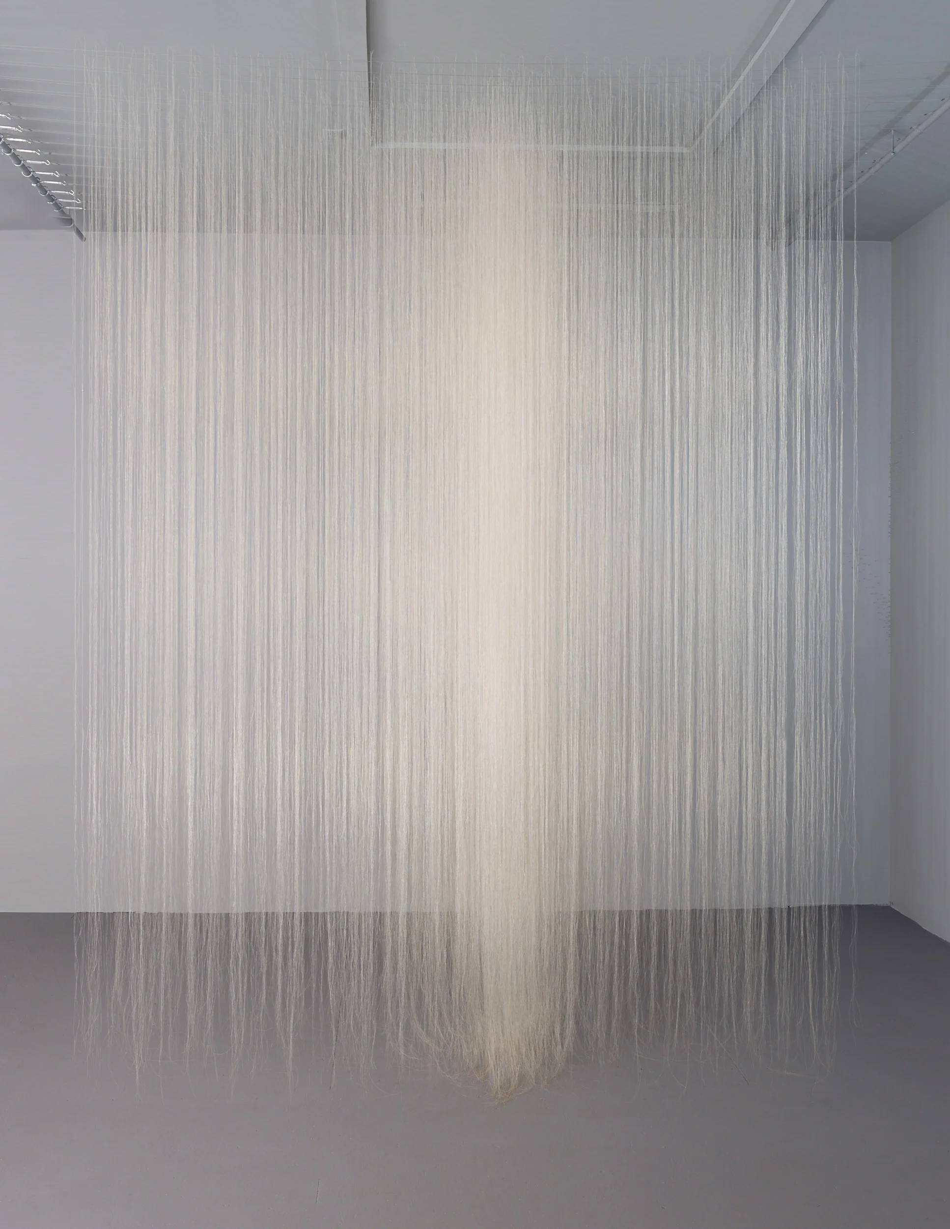 White Luminous Room; horsehair, thread, cable; 10 x 7 x 7 feet