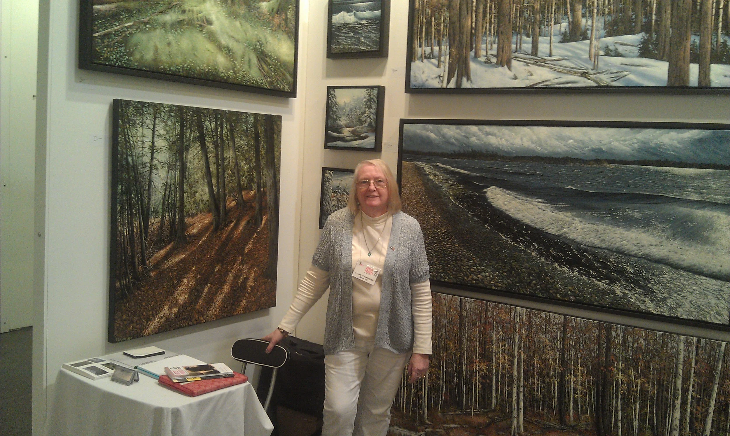 Biography of Lynne Schumacher I was born Toronto, 1950 and started painting at an early age. I studied commercial art at Central Technical School under Doris McCarthy before turning my attention to landscape painting. Many hundreds of hours were spent in the Northern Ontario forests researching, sketching, photographing and painting my subjects. A considerable amount of my childhood was also spent in Nova Scotia where I developed a love for the sea and the Maritime way of life. My previous work was based on close studies of trees, their many textures, moods and the effects of the various seasons upon them. I developed a great love and respect for nature and painstakingly applied paint to canvas to capture a startling realism and a boldness of colour and texture. My landscapes show the wonderfully varied beauty of the Canadian land. I started exhibiting in 1973 at the Arts-in-the-Parks and then subsequently the Markham Art Show, Carling’s Art Show, Toronto City Hall and many other annual group shows in the Toronto area. I have participated in the following art sales events: Toronto Art Expo Kempenfest (Barrie) Muskoka Art Show Junction District Arts Festival Distillery District Arts Festival Burlington Art Market Credit Village Marina Art Show University of Guelph Art Exhibition Ottawa Art Festival Riverdale Art Walk Buckhorn Fine Arts Festival McMichael Volunteers Art Show and Sale The Artist Project Toronto Headwaters Art Festival Arts on the Credit My paintings will be found enhancing numerous collections by both private and corporate collectors throughout Ontario, across Canada, the United States, England, Germany and China. I have received various letters of commendation from noted Canadian galleries. I have been written up in the Toronto Globe and Mail, the Mississauga Times and the Brampton Guardian. I have won first place awards in various art competitions. In addition to landscape painting, I have expanded my horizons to portray the rich diversity of our community in the people and their colourful cultural contribution to the Canadian mosaic. My paintings operate on many levels involving form colour and place. They aim to visibly document my thoughts and try to express my vision, pulling the viewer into another world. Lately, my artistic visions have taken on a more abstracted quality, experimenting with different media and allowing me to develop new ideas. I am a member of Beaux Arts Brampton, Colour and Form Society and Ontario Society of Artists. I am also a participant in the Art Gallery of Ontario Arts Rental programme, the Art Gallery of Hamilton Arts Rental programme and the Arts Etobicoke Rental programme. My recent entries to juried shows include: Beaux Arts Brampton various shows in 2006 - current Colour and Form Society Juried Art Shows 2006 - current Colour and Form Society Two by Two traveling show 2007, 2008 Etobicoke Arts Group Juried Art Shows 2005 – 2011 Franklin Carmichael Open Juried Show 2012 Lakeshore Arts Juried Art Show 2006 - current Neilson Park Creative Centre various shows in 2006, 2007 Ontario Society of Artists Juried Art Shows 2008 - current Peel Juried Art Show – 2004 – 2008 Society of Canadian Artists Open Juried shows 2009 - 2012 Uxhibition 2009 - 2014 Visual Arts Mississauga Juried Art Show 2005 - 2011 My web site can be found at: www.lynneschumacher.com 