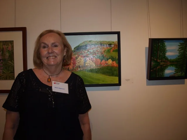 Artist Helen Duplassie with one of her artworks that was exhibited at the Holcim Gallery April 10 to 30, 2017.