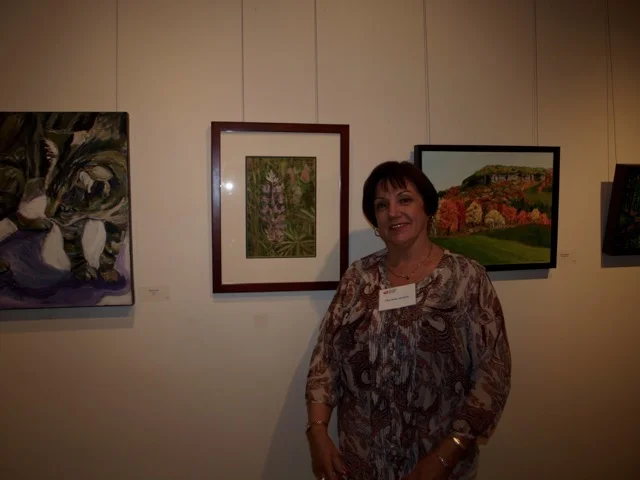 Artist Charlene Nickels with one of her artworks that was exhibited at the Holcim Gallery April 10 to 30, 2017.