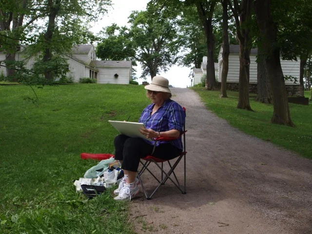 Helen Duplassie painting plein air at Scottsdale farm.