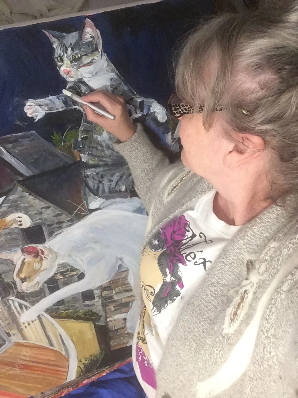 Artist Janice Ykema working on a new artwork called "Meow Mix"