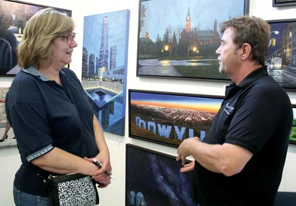 Artist Steve Wilson being interviwed at the Carmel Fine Arts Festival 2017.