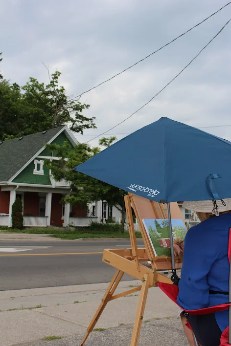  Artist Helen Duplassie doing plein air painting of a house on Main Street, Acton 