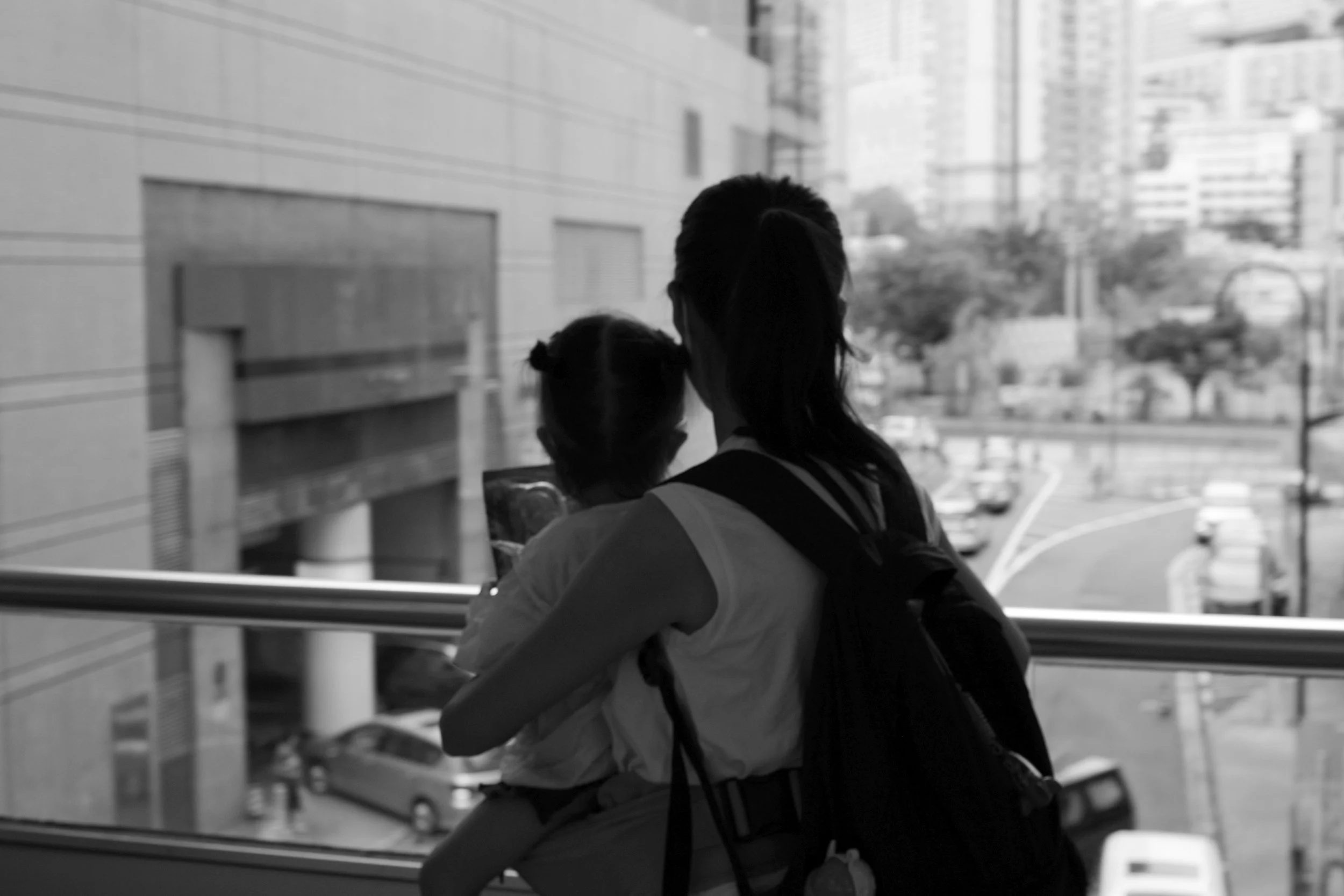 Woman holding small child in a courthouse