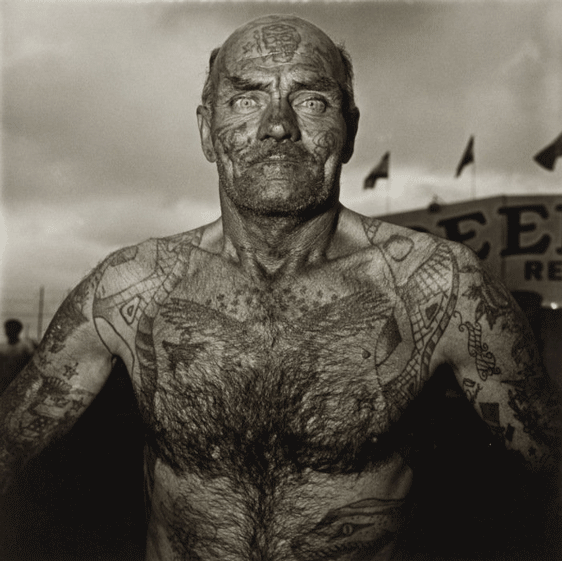 tattooed-man-at-carnival-1970-Scandaleuse Photography-Diane Arbus-photographer-toronto-female photographer-canada-ontario-blog-blogger-toronto photographer-photo.png