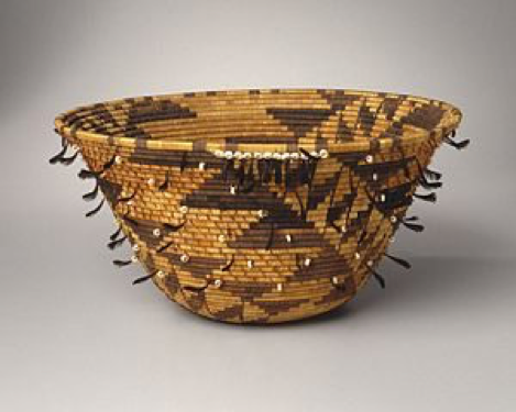 Girl's Coiled Dowry or Puberty Basket (kol-chu or ti-ri-bu-ku), late 19th century. Willow, sedge root, bulrush root, acorn woodpecker scalp feather, California valley quail topknot feather,oilivella biplicata shell, cotton string, 7 x 14 1/2 x 14 1/2 in. (17.8 x 36.8 x 36.8 cm). Brooklyn Museum