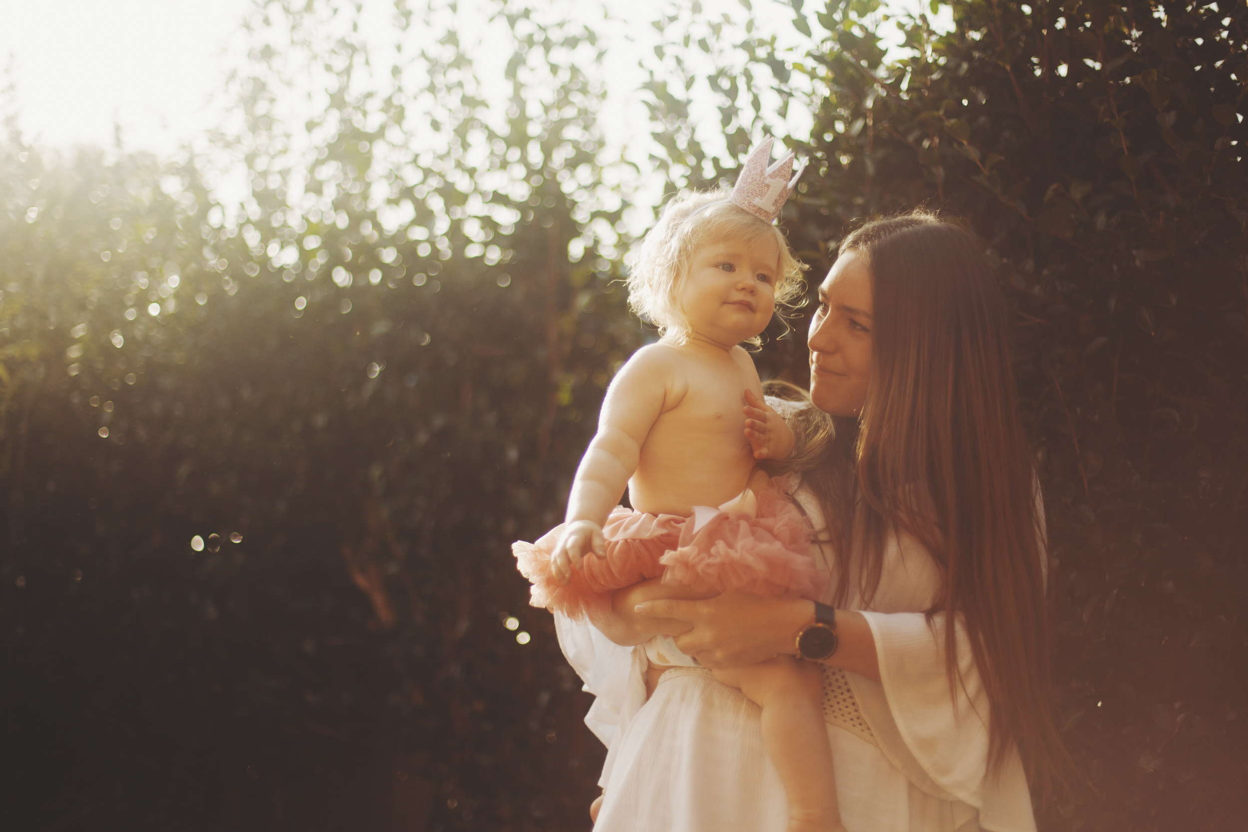 Mother and baby at first birthday party