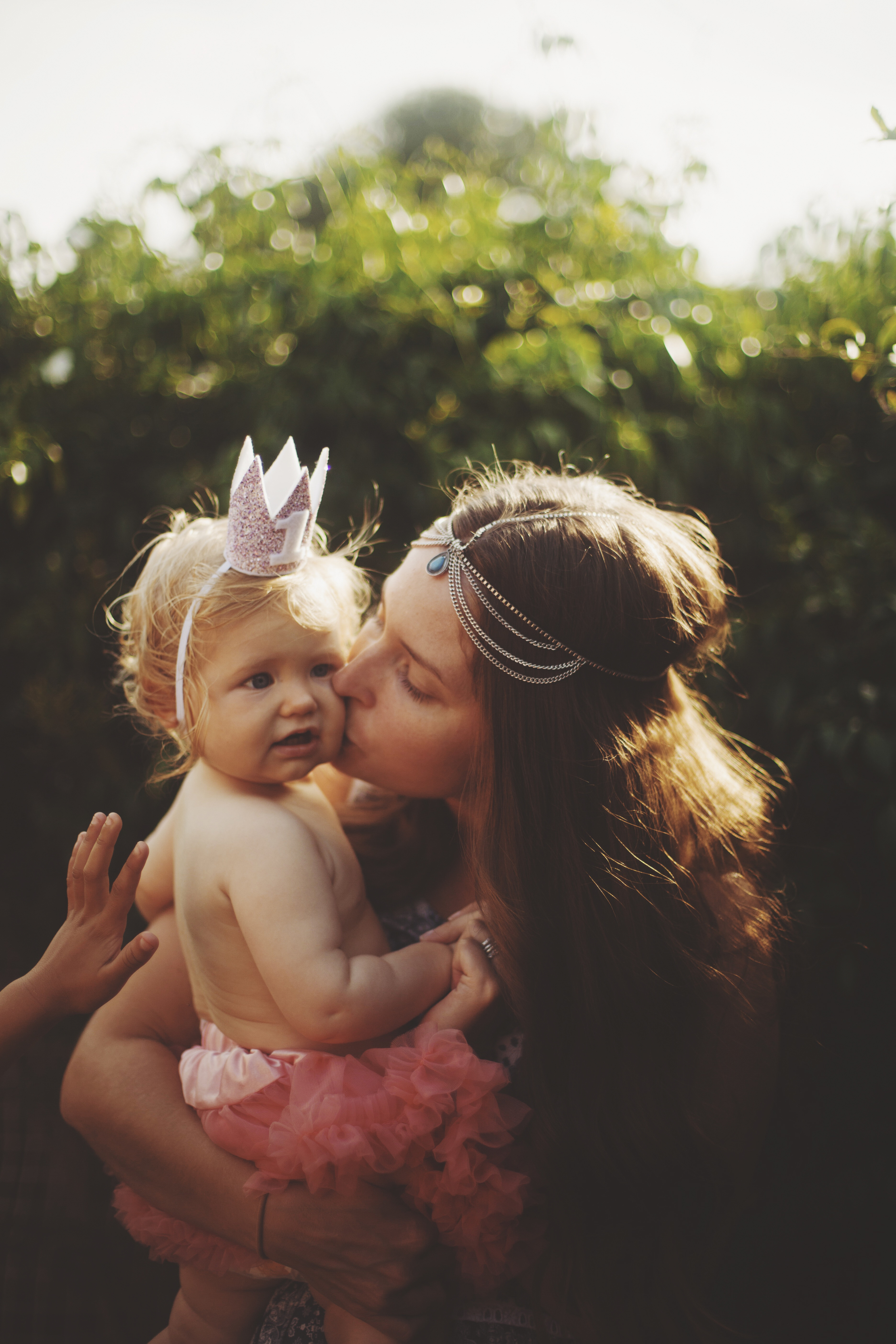 Mother and baby at first birthday party