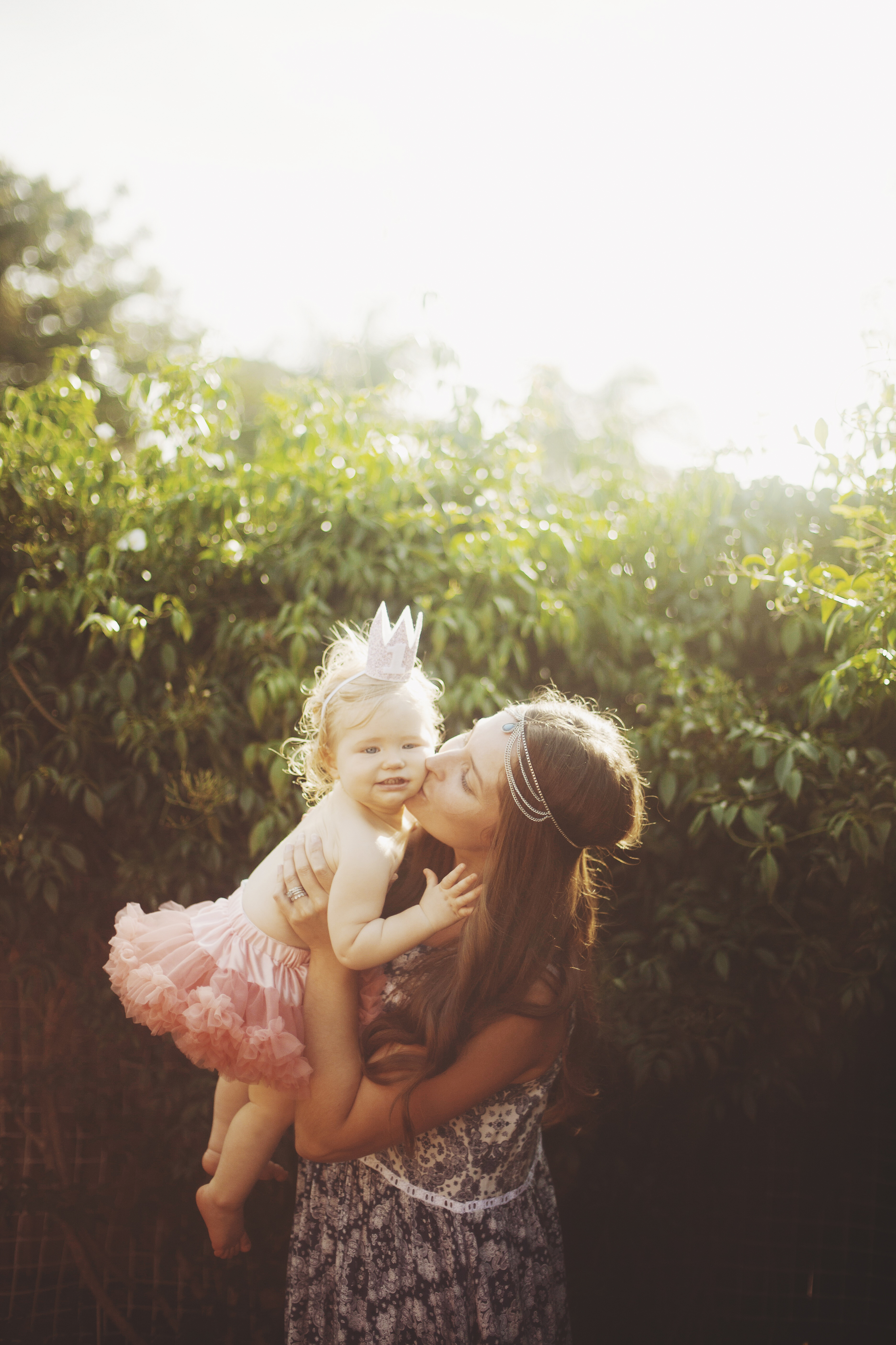 Mother and baby at first birthday party