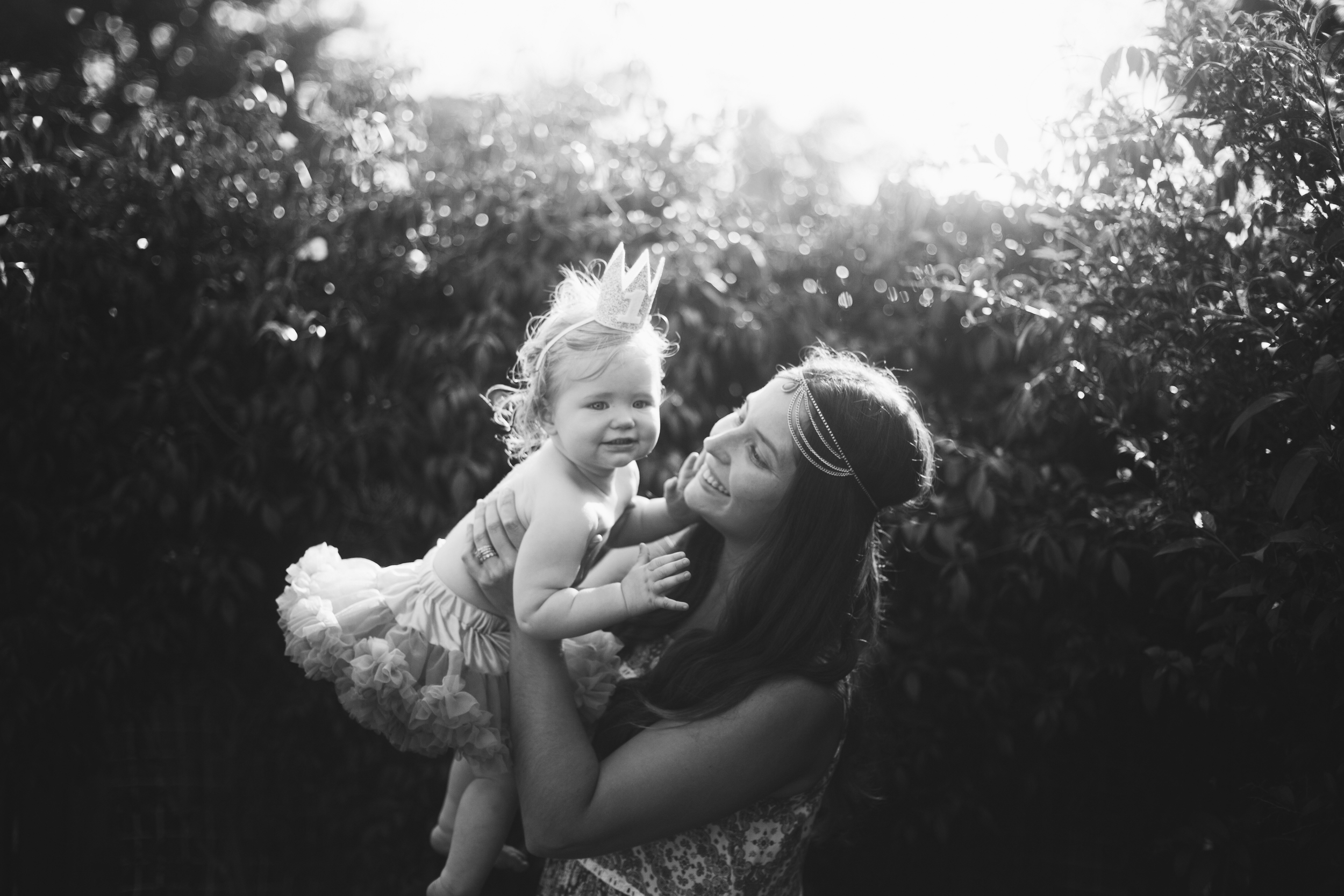 Baby wearing tutu and birthday at at first birthday party